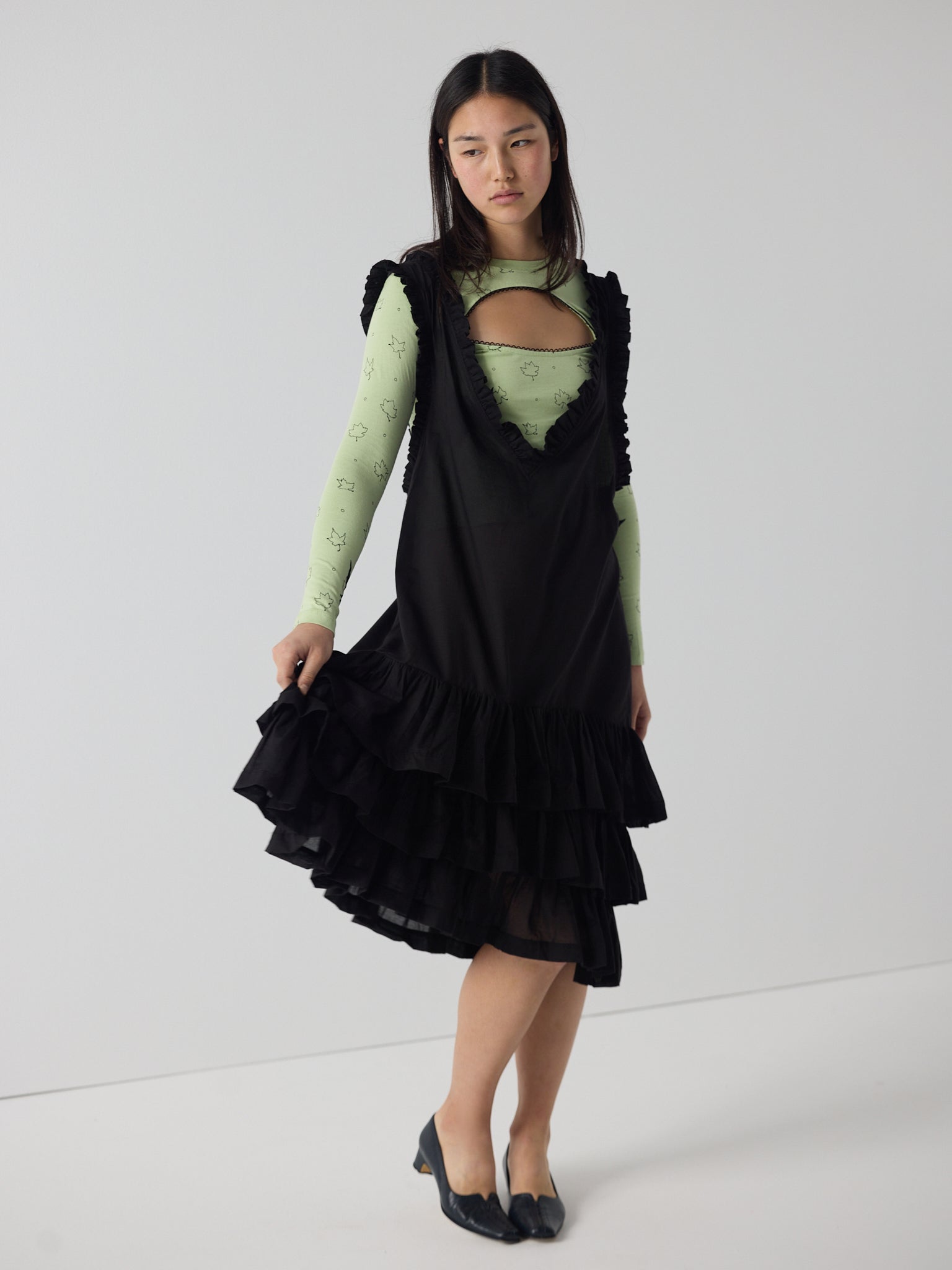 Apron frill drop waist dress in black