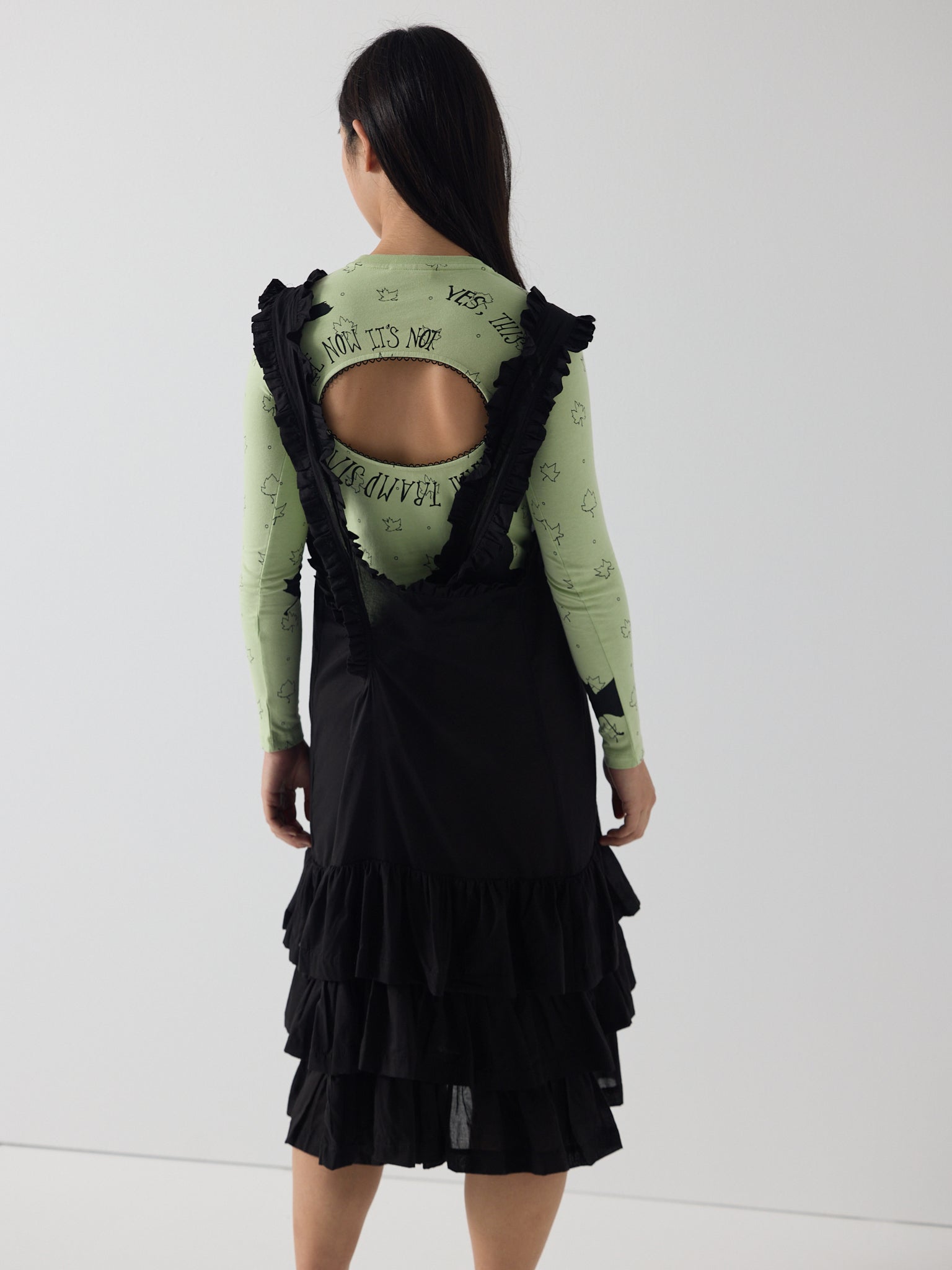 Apron frill drop waist dress in black