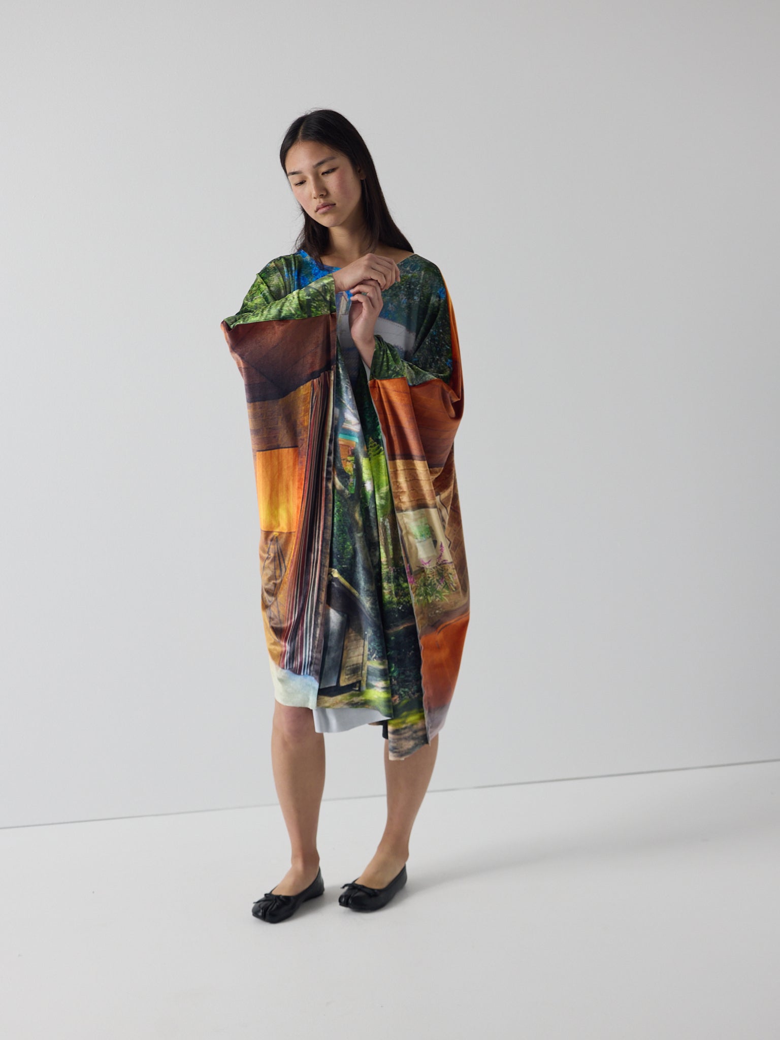 amelia wears the niamh galea house dress in super velvet, showing the drape and sheen of the printed velvet