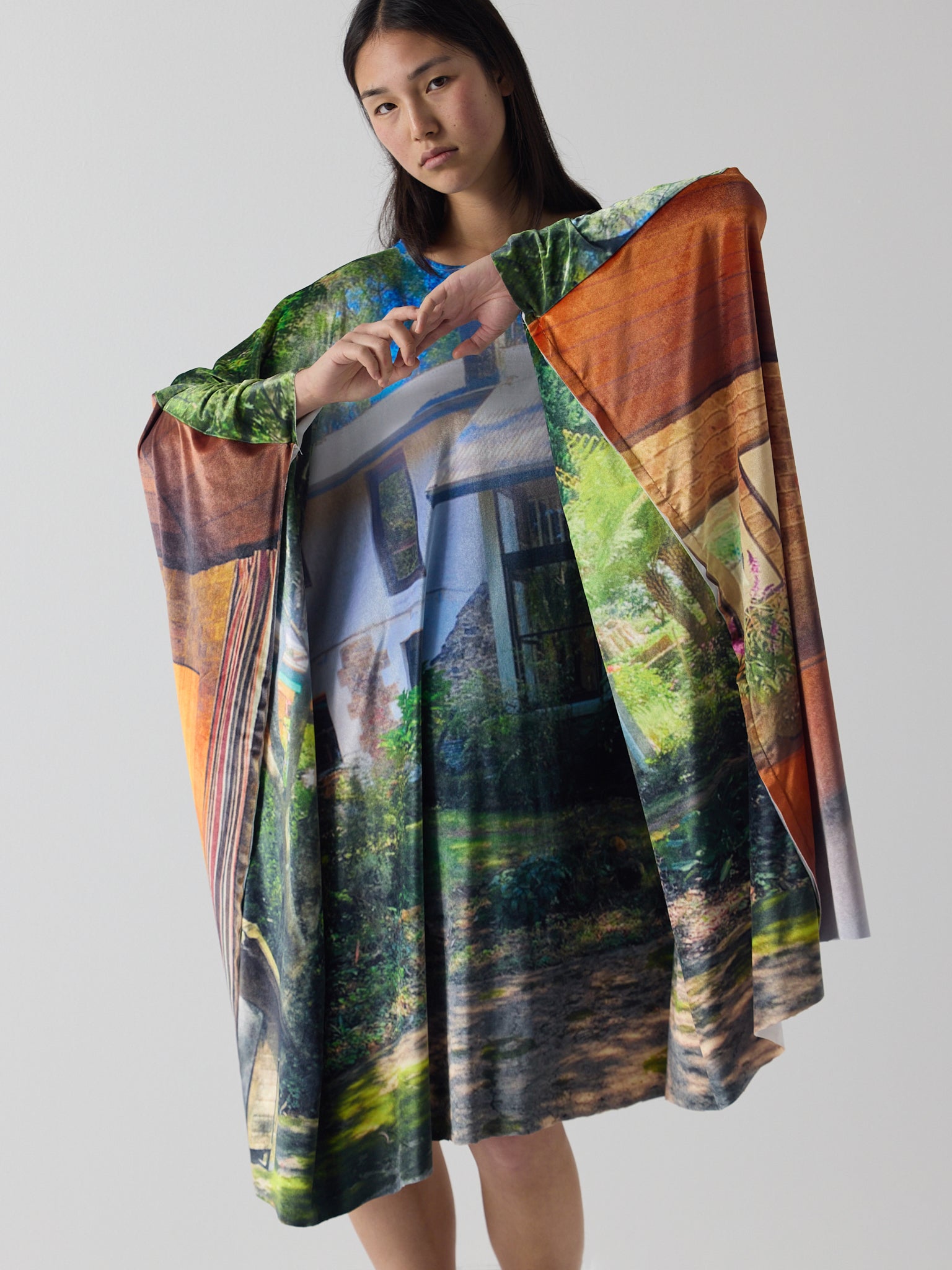 amelia wears the niamh galea house dress in super velvet, printed with original photography of a dream house in sydney's blue mountains