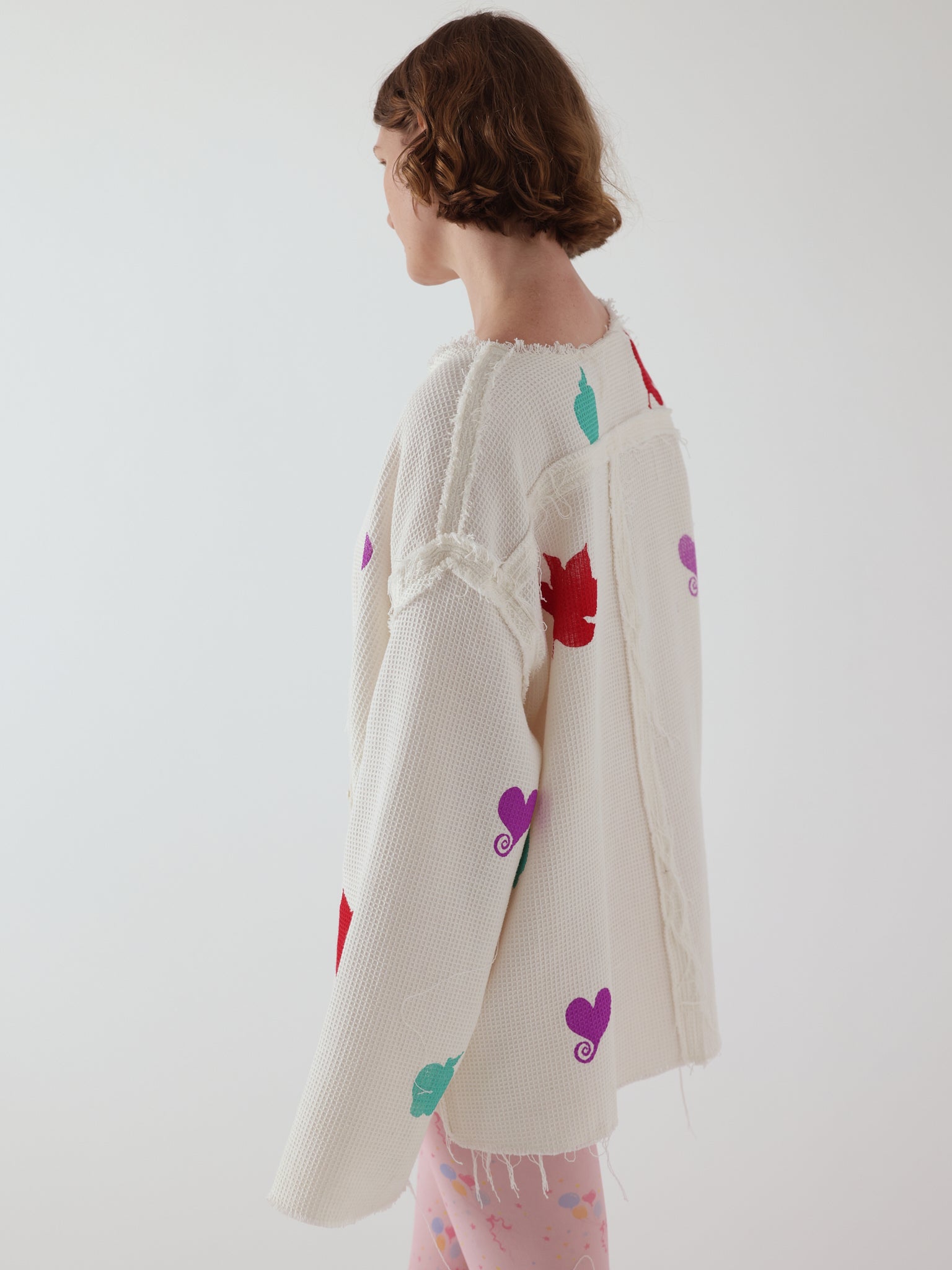 the niamh galea waffle groom shirt in white, showing the exposed raw seams and topstitch finishing