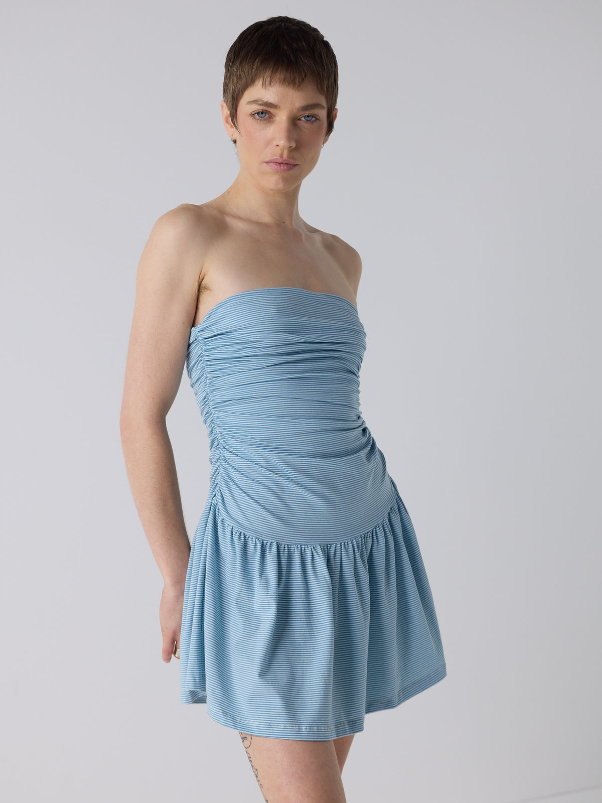 honor wears the twist dress in blue micro stripe, fit 1