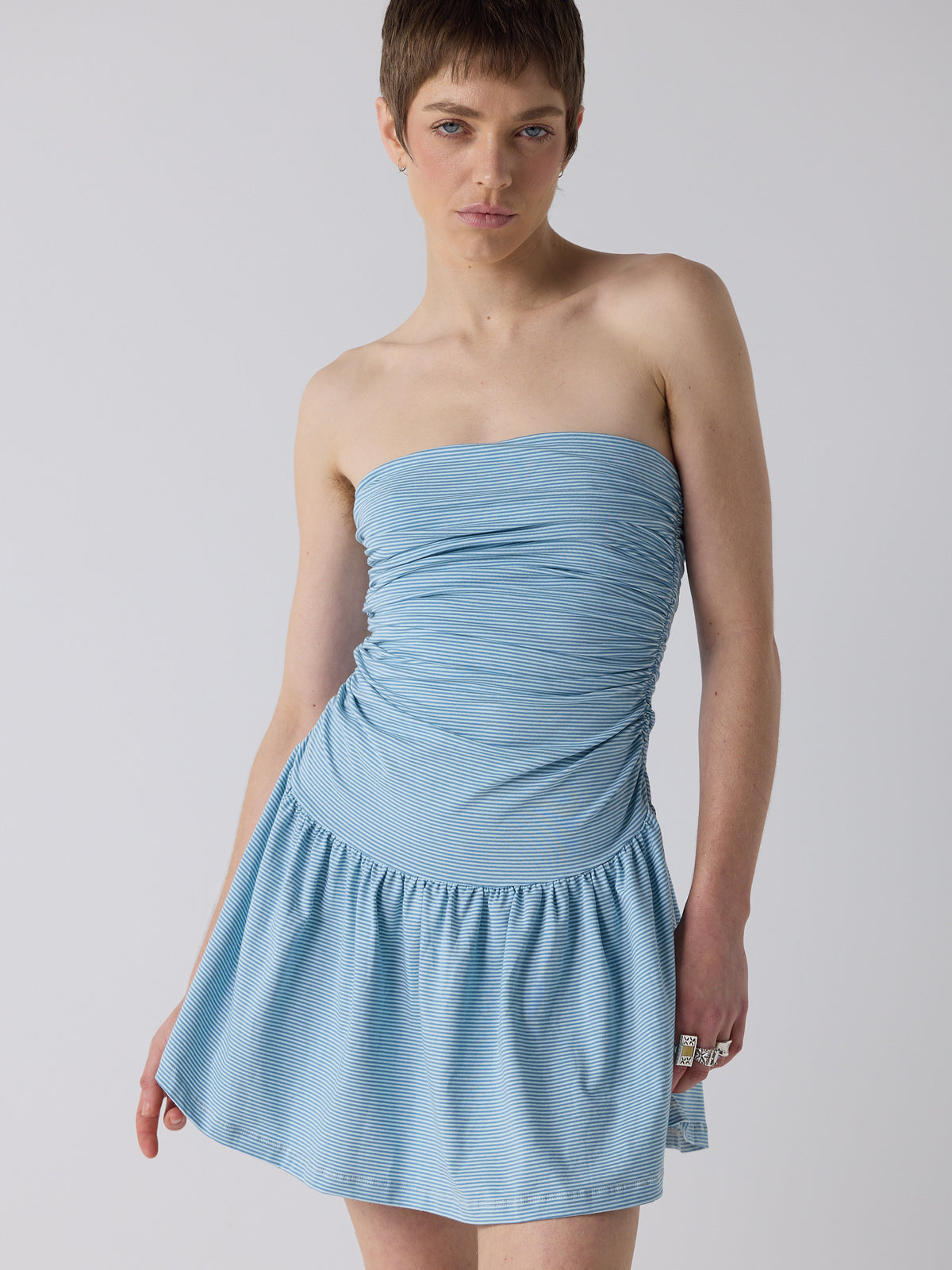 honor wears the twist dress in blue micro stripe, fit 1