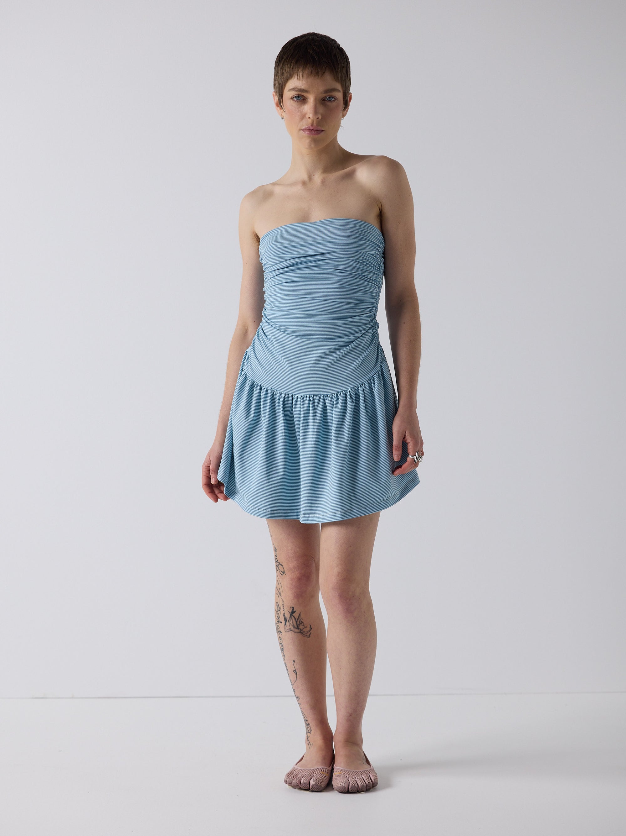 honor wears the twist dress in blue micro stripe, fit 1