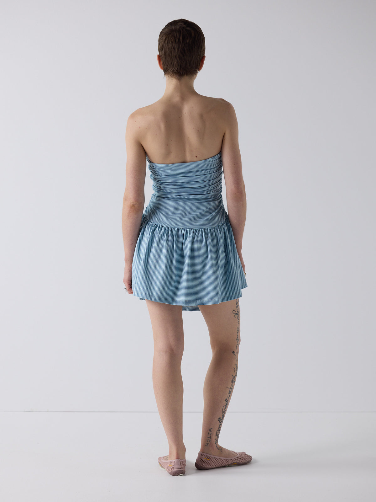honor wears the twist dress in blue micro stripe, fit 1
