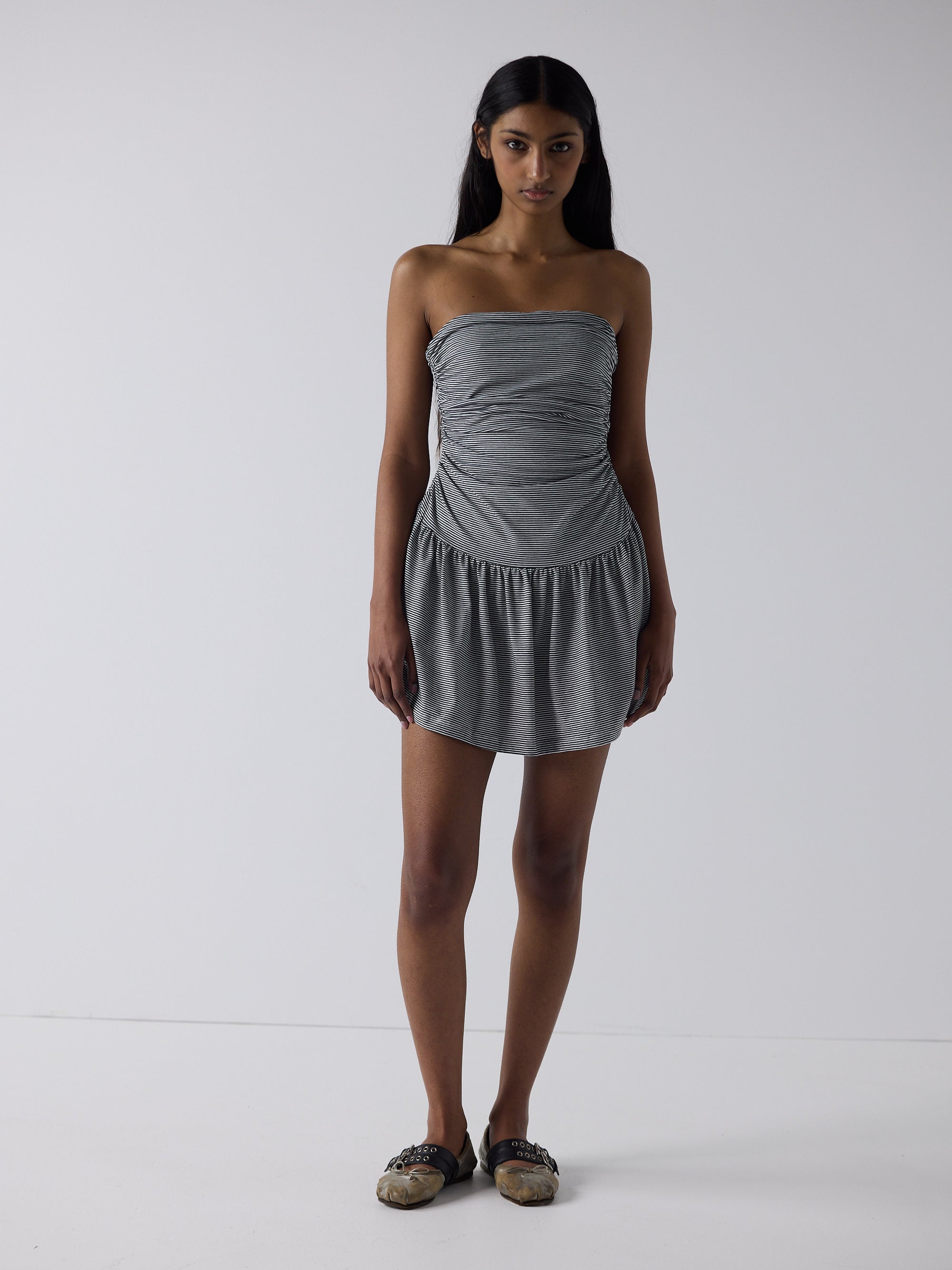 haasi wears the twist dress in black micro stripe, fit 1