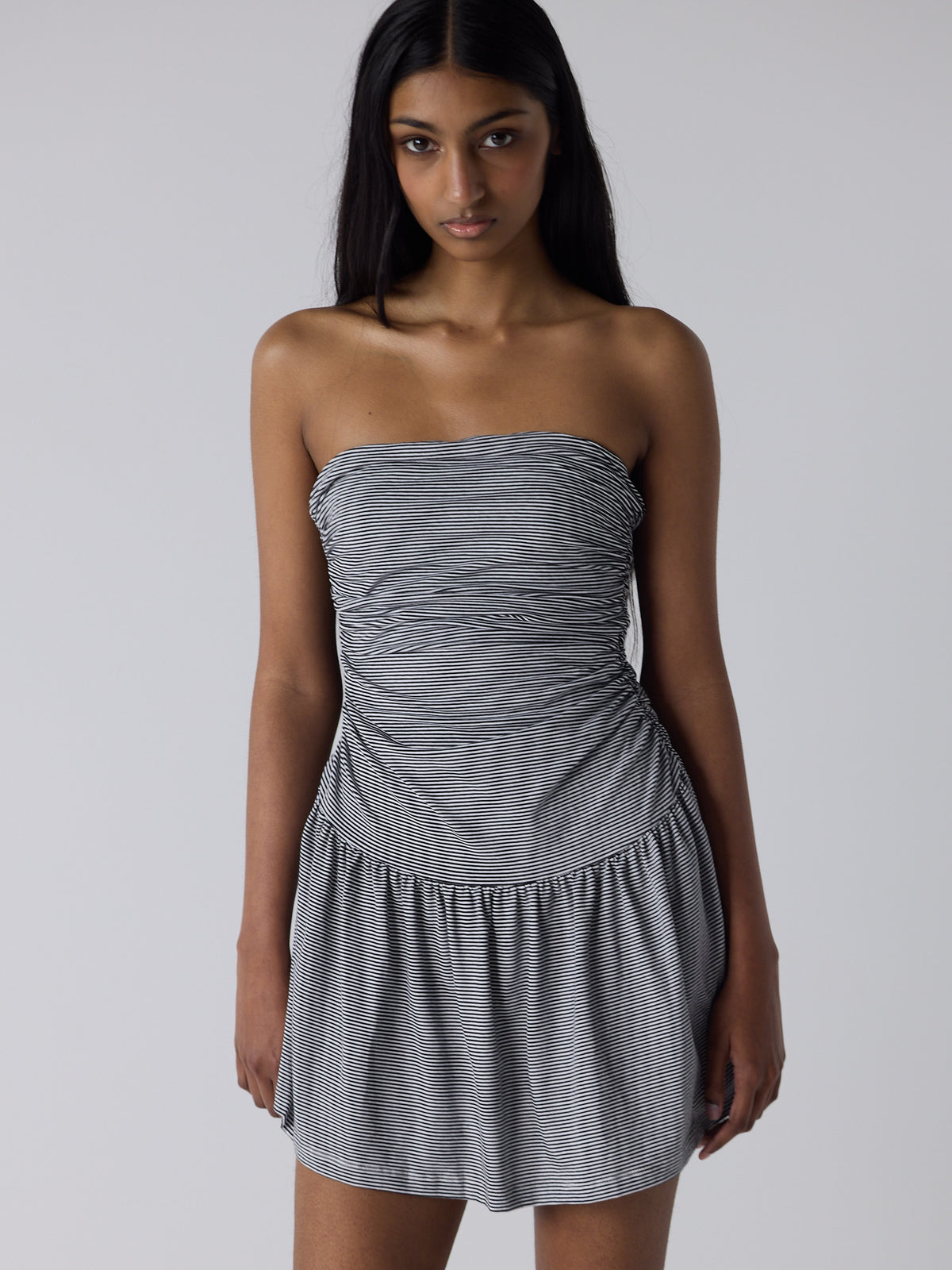 haasi wears the twist dress in black micro stripe, fit 1