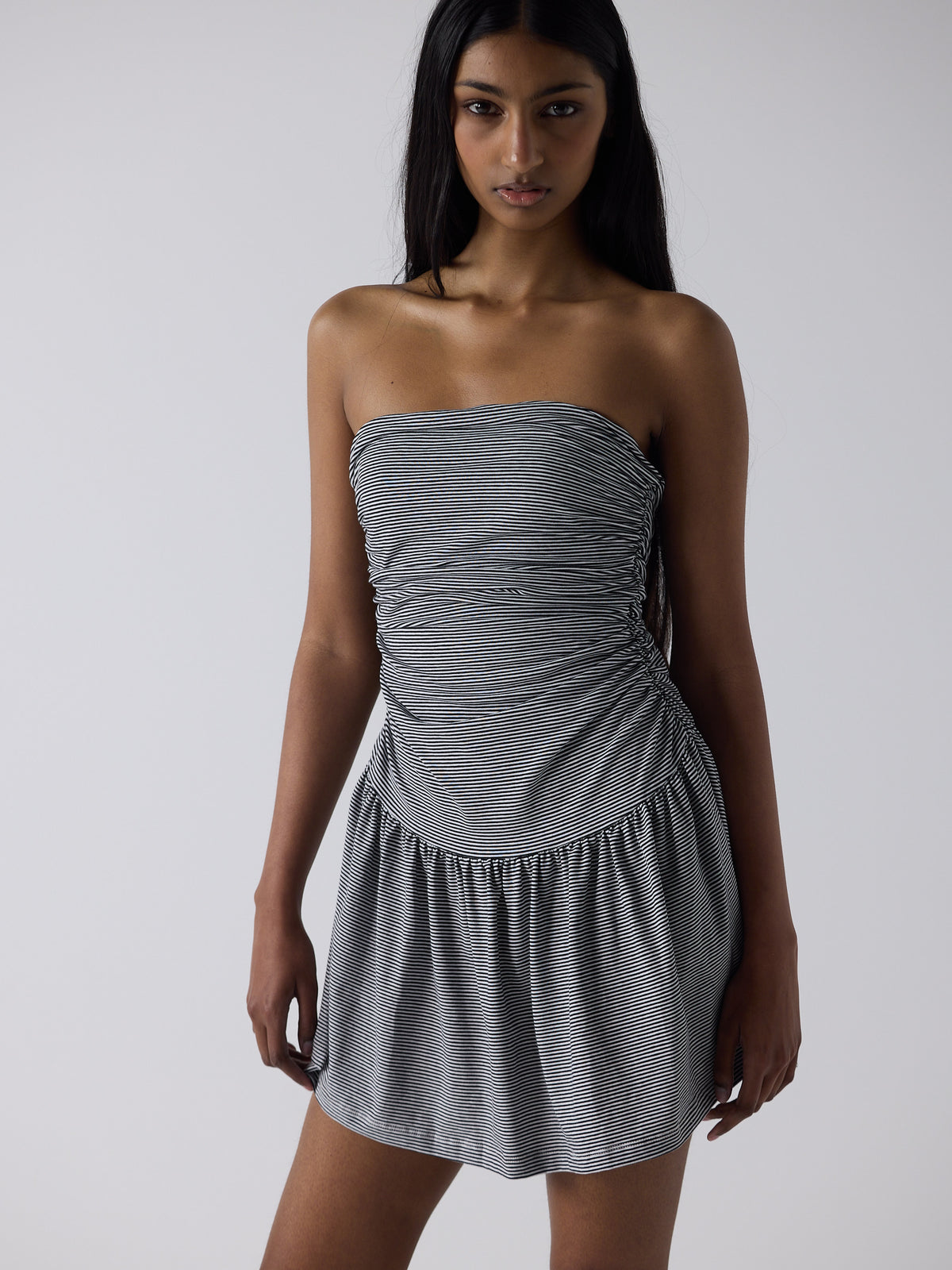 haasi wears the twist dress in black micro stripe, fit 1