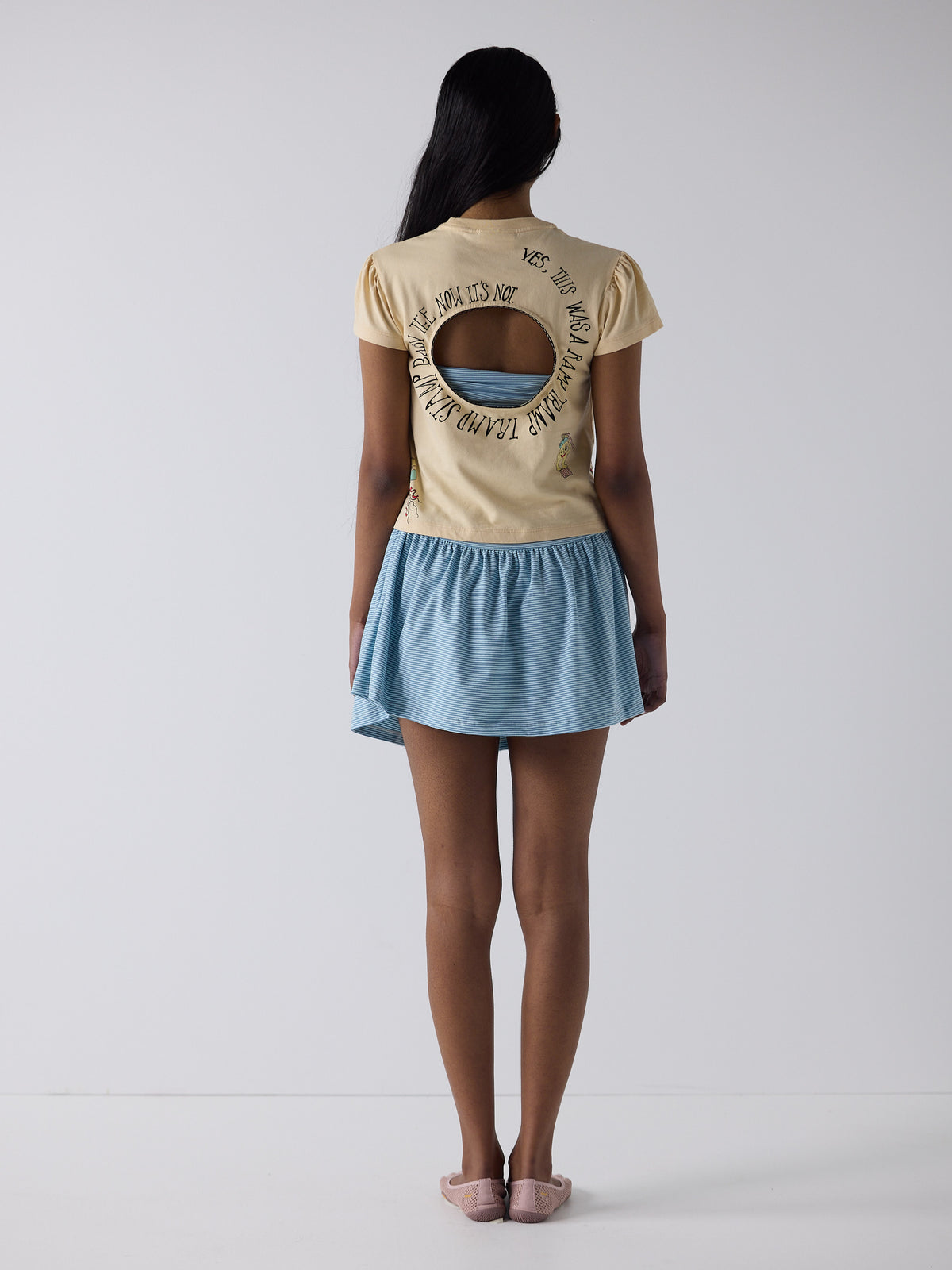 haasi wears the logo removal baby tee in cutie creme fraiche, size m