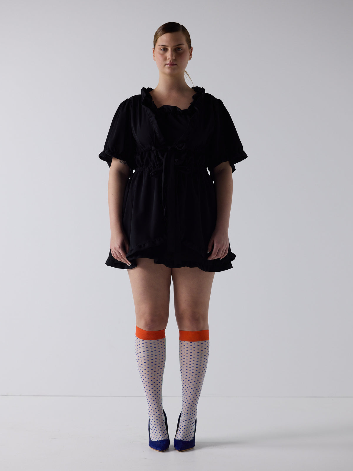 kim wears the babydoll dress in black, fit 2