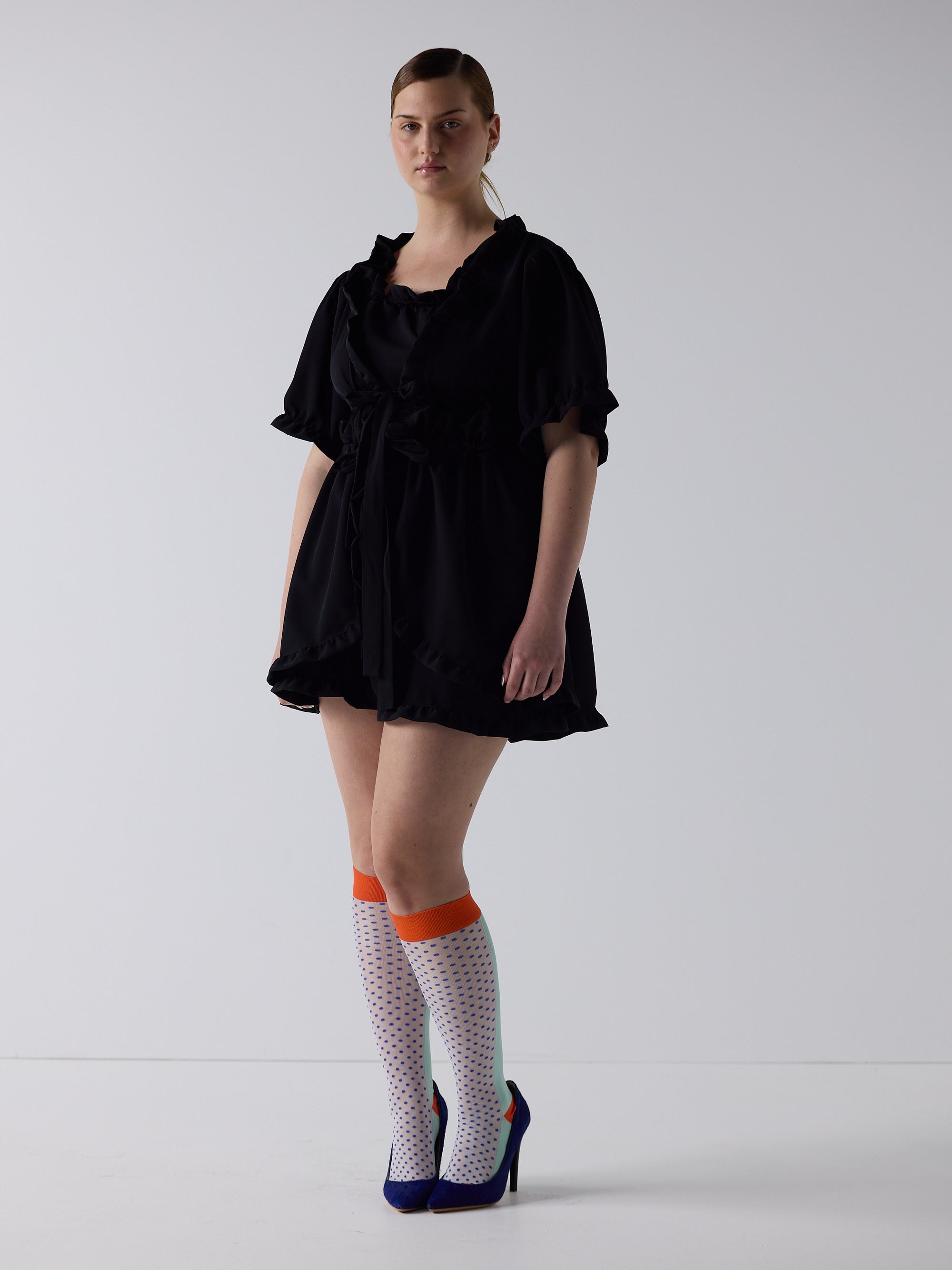kim wears the babydoll dress in black, fit 2