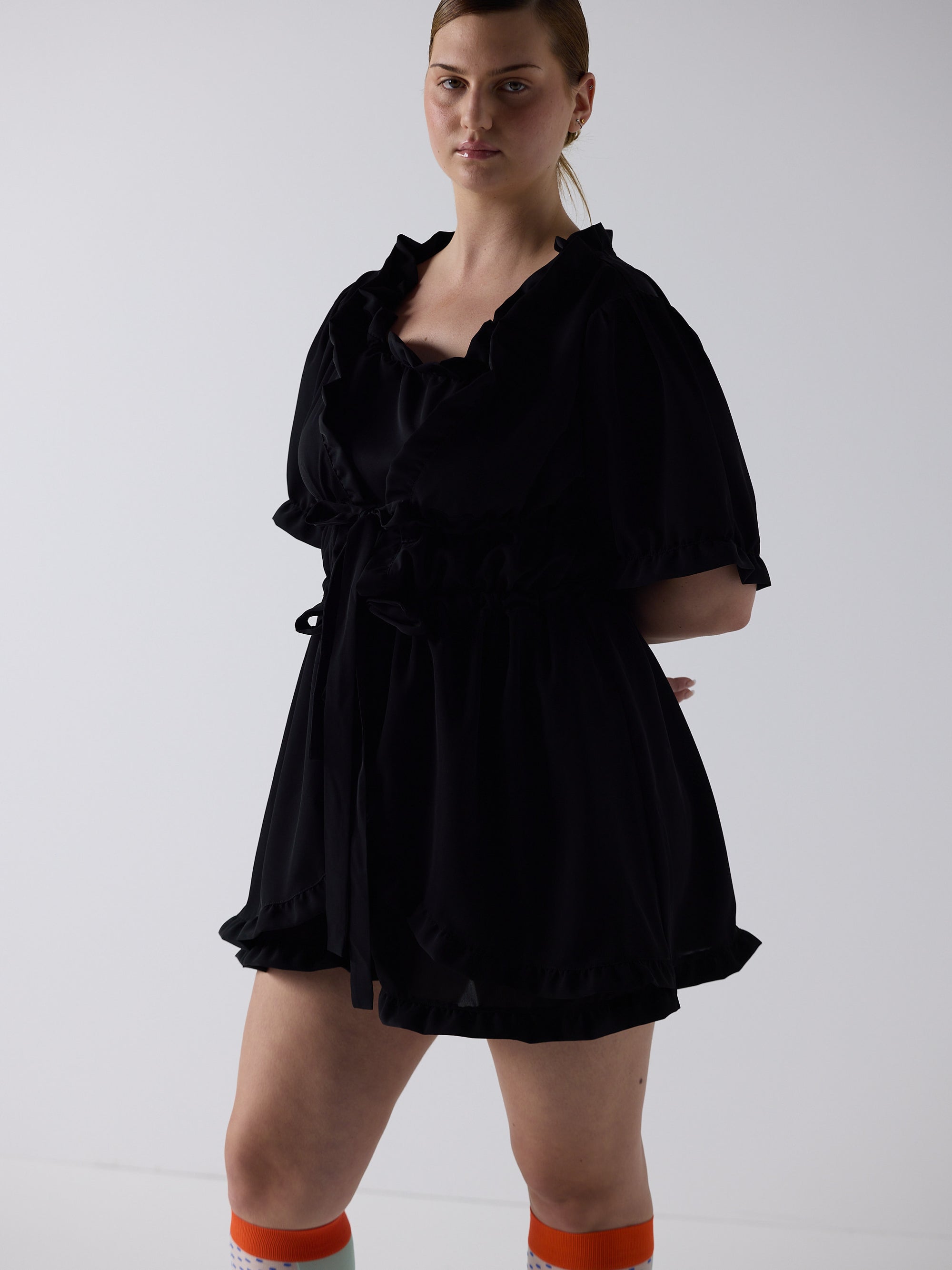 kim wears the babydoll dress in black, fit 2