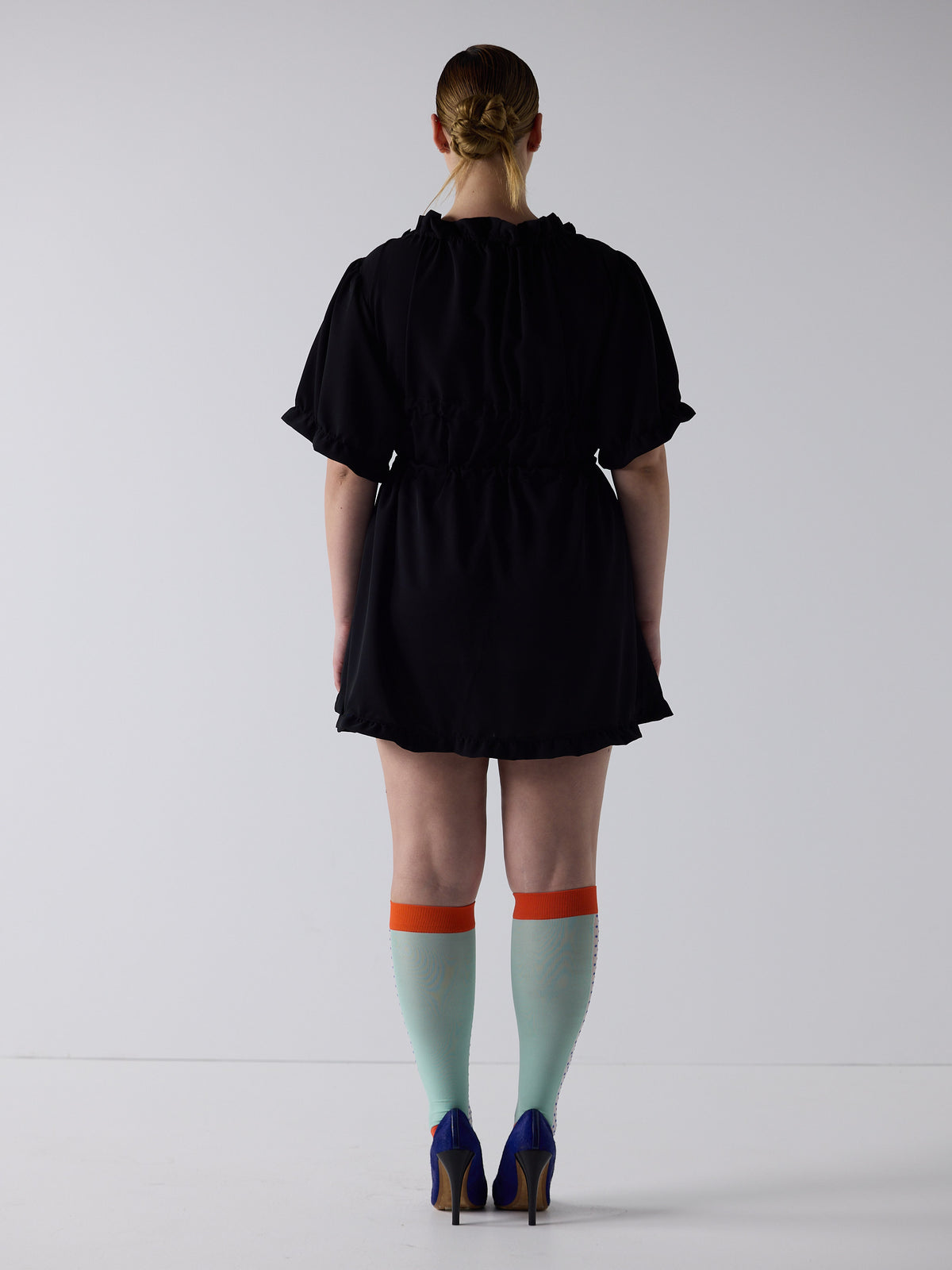 kim wears the babydoll dress in black, fit 2