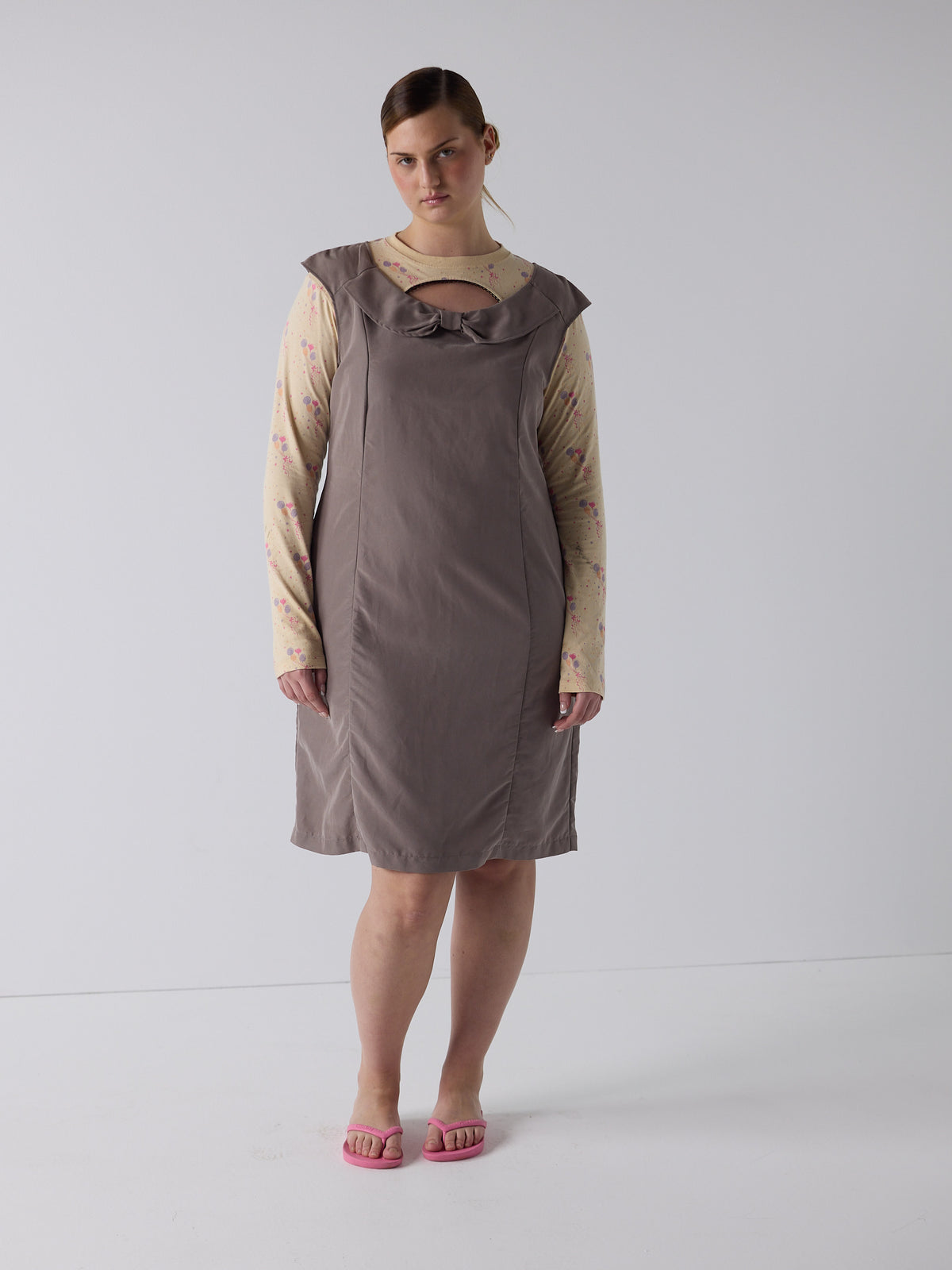 kim wears the office bow dress in fawn