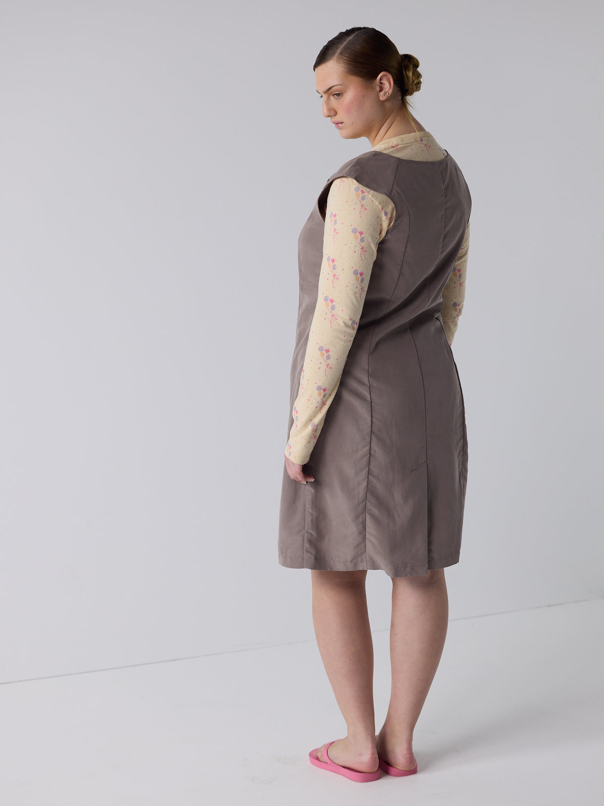 kim wears the office bow dress in fawn