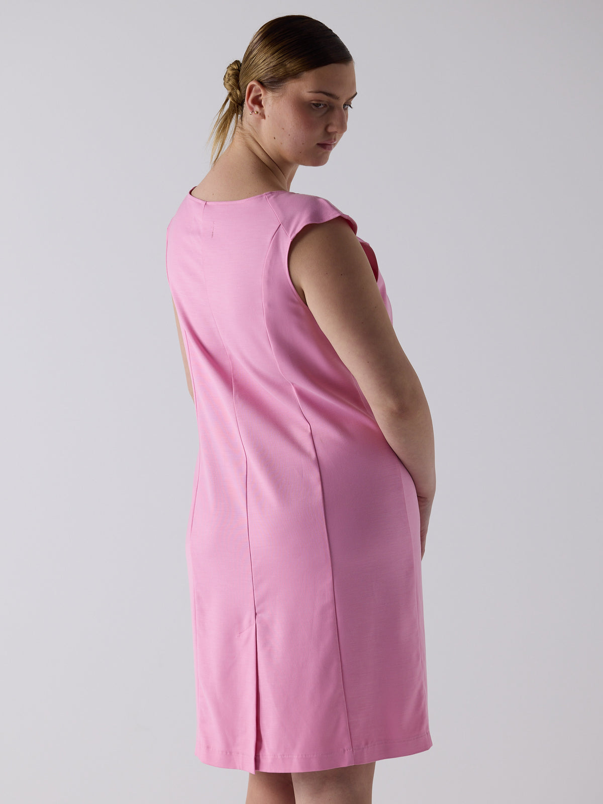 kim wears the office bow dress in bubblegum pink
