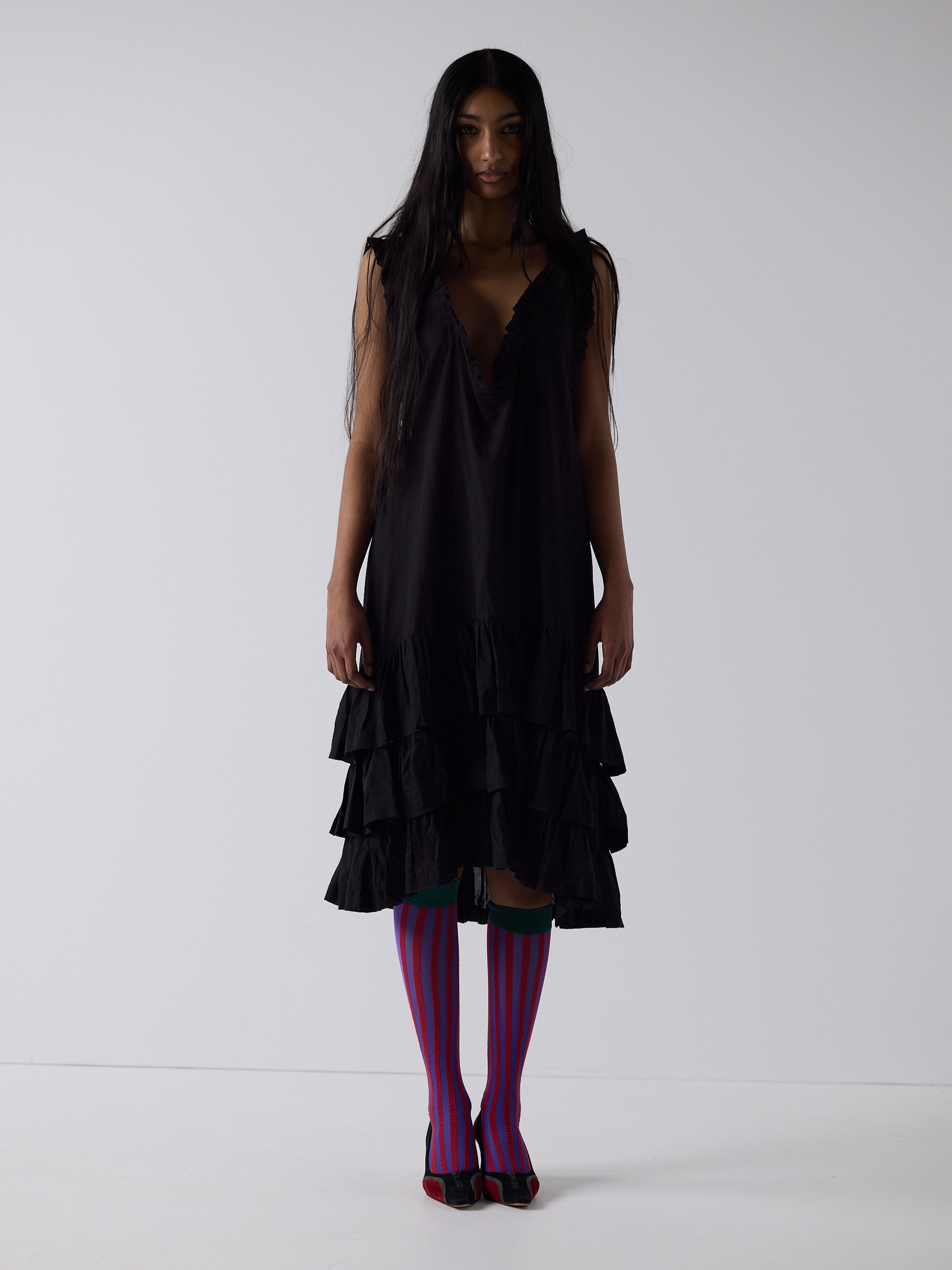haasi wears the apron frill drop waist dress in black