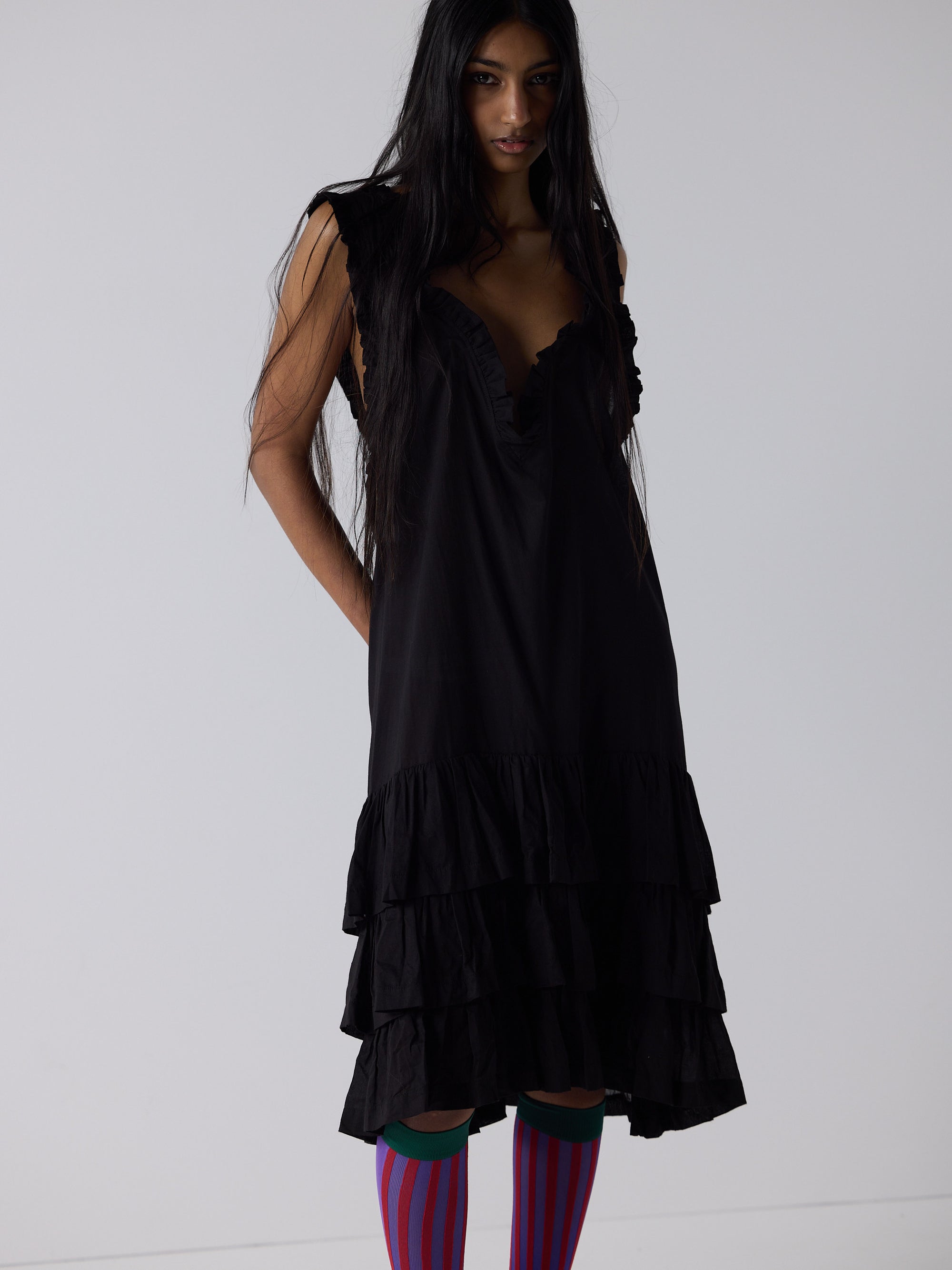 haasi wears the apron frill drop waist dress in black