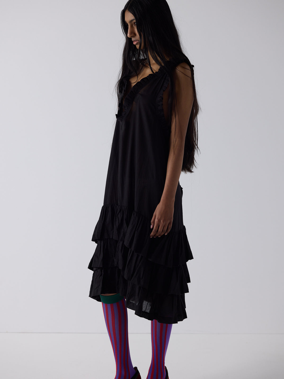 haasi wears the apron frill drop waist dress in black