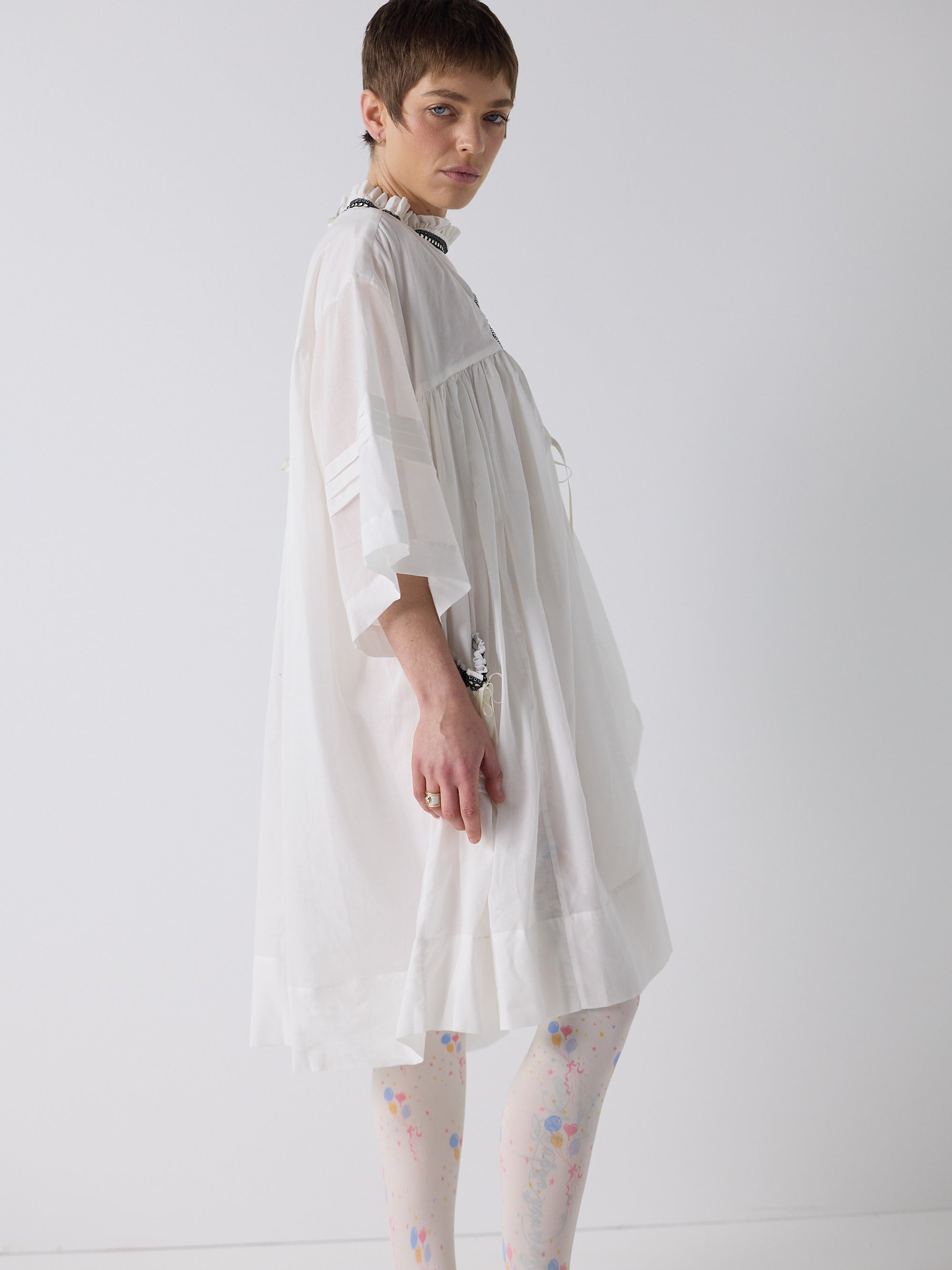 honor wears the holy smock dress in tooth white