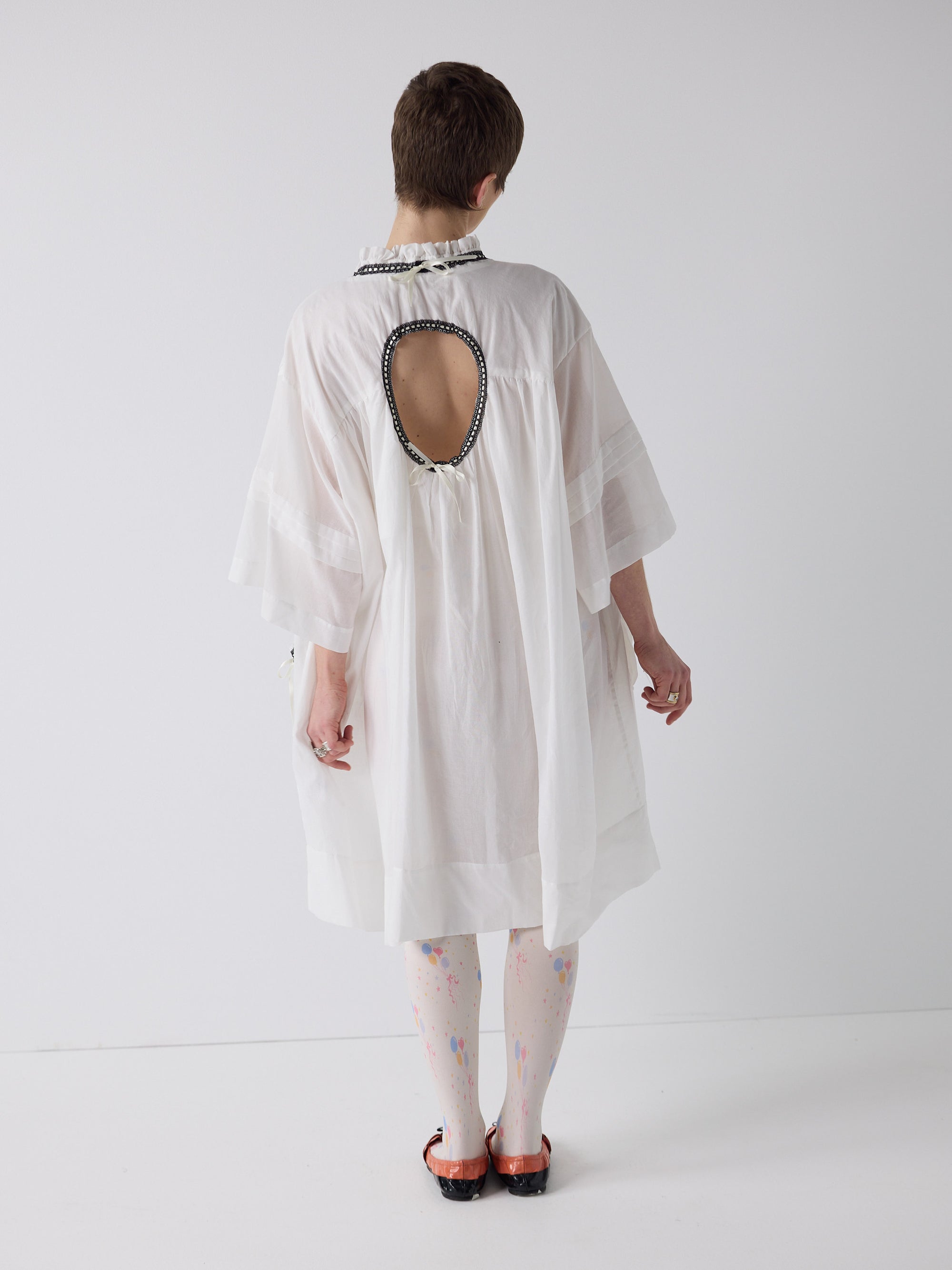 honor wears the holy smock dress in tooth white
