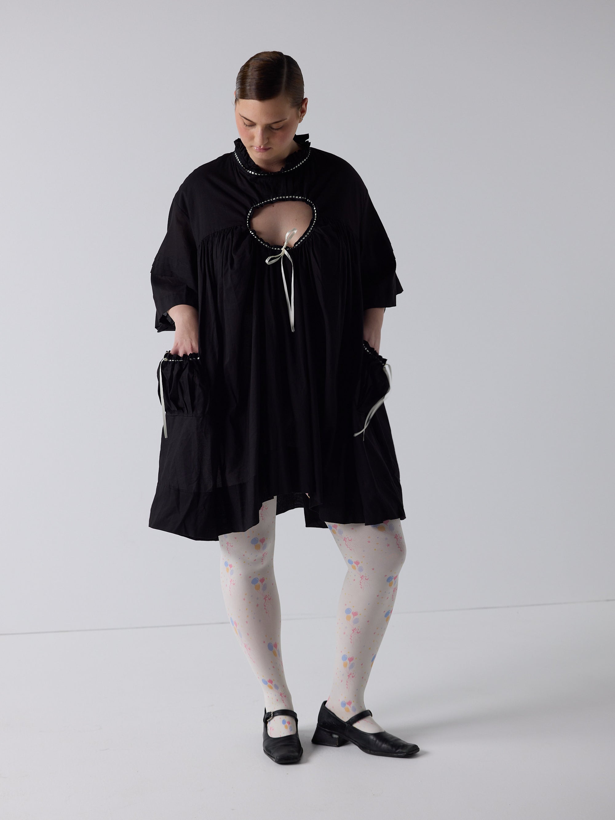 kim wears the holy smock dress in black