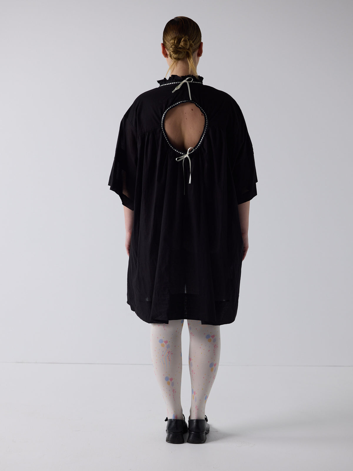 kim wears the holy smock dress in black