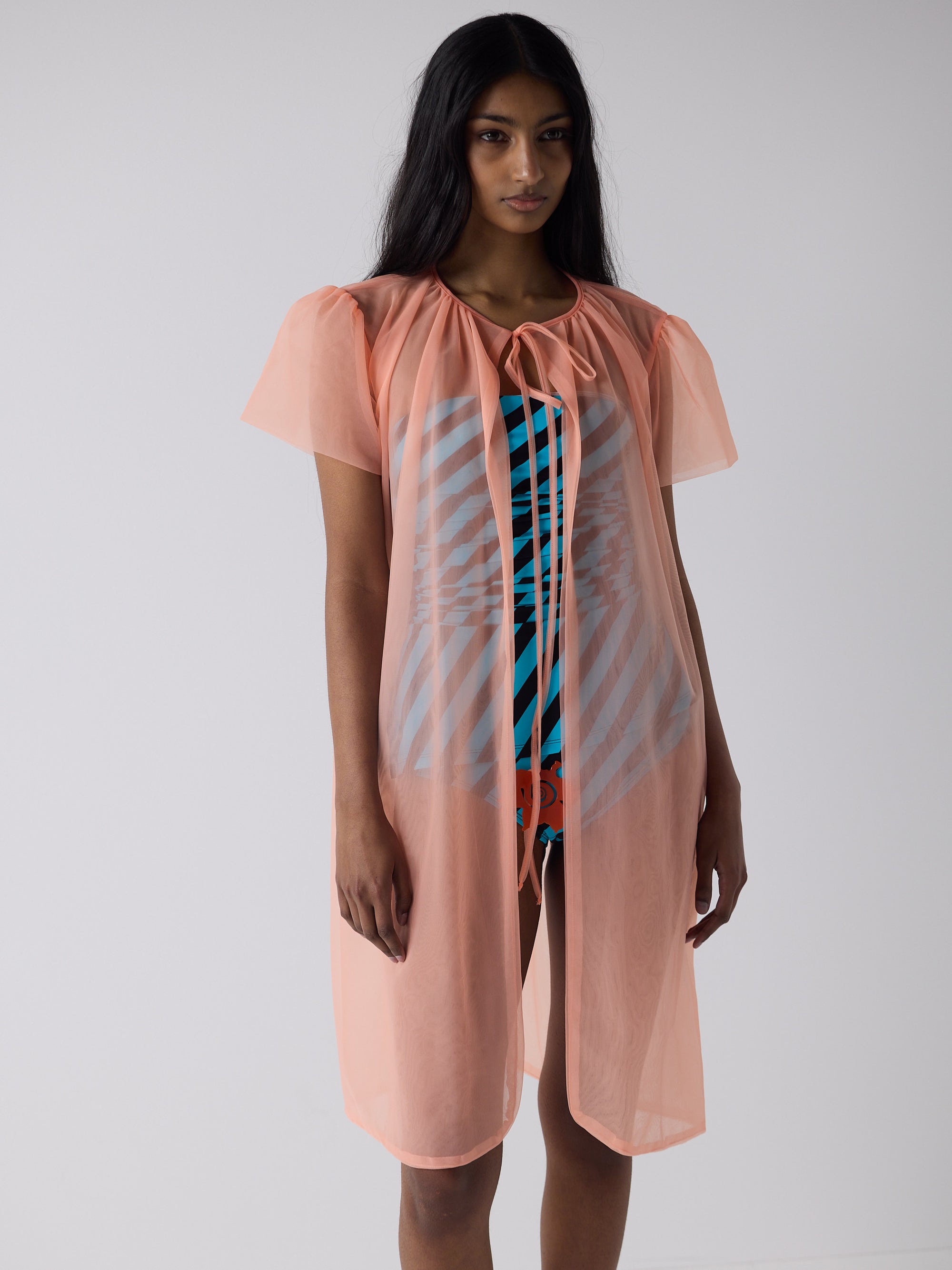 haasi wears the peignoir in soft flame