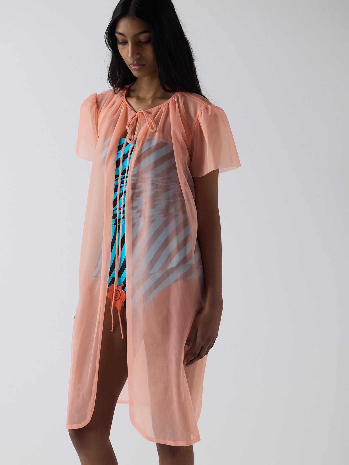 haasi wears the peignoir in soft flame