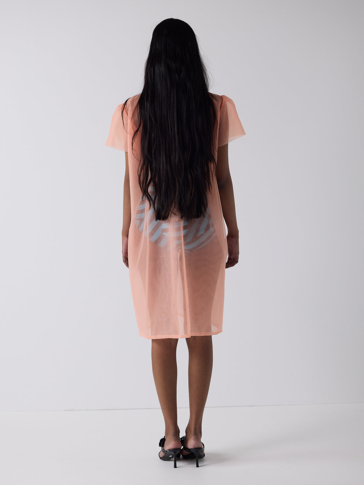 haasi wears the peignoir in soft flame