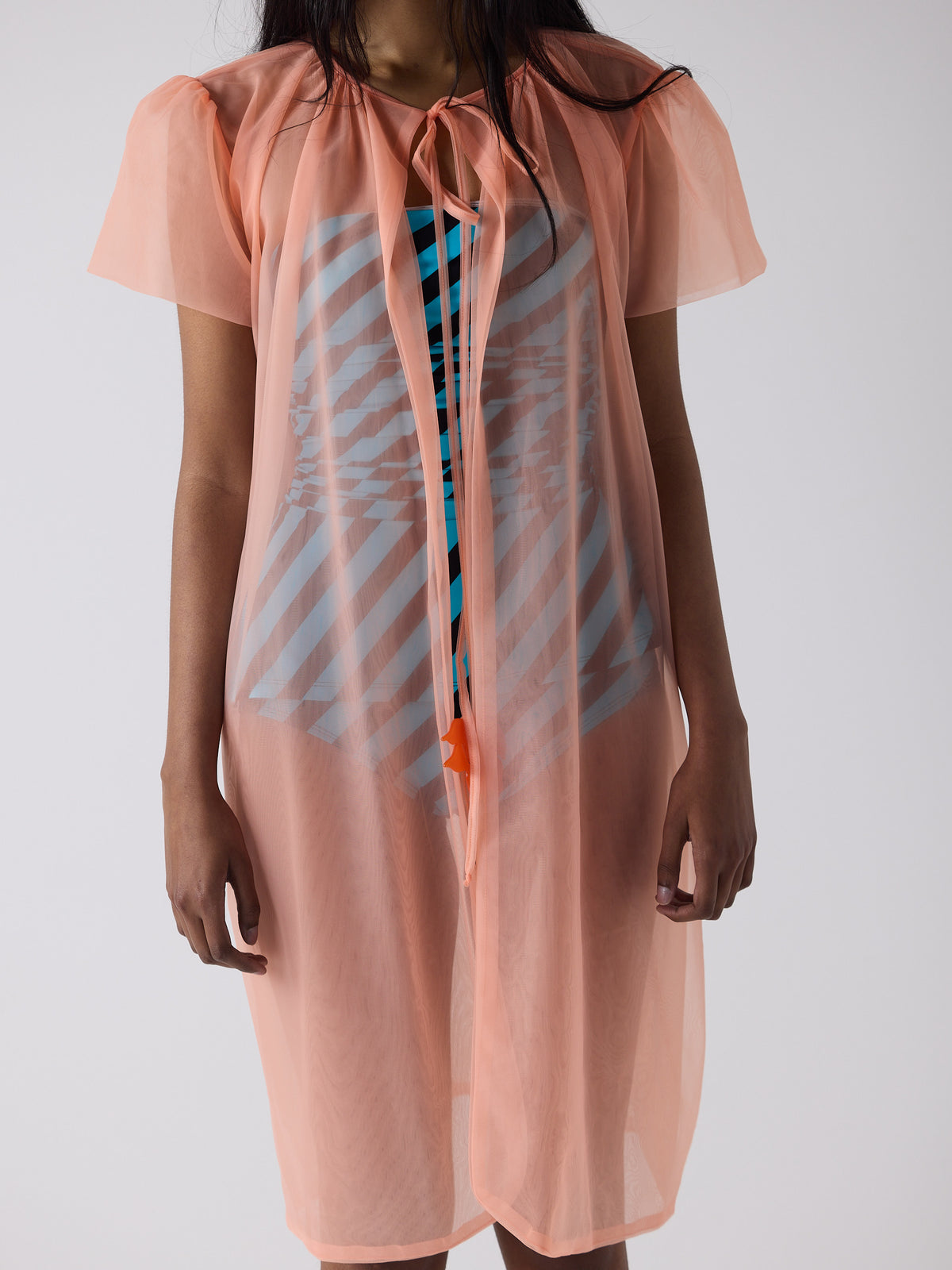 haasi wears the peignoir in soft flame
