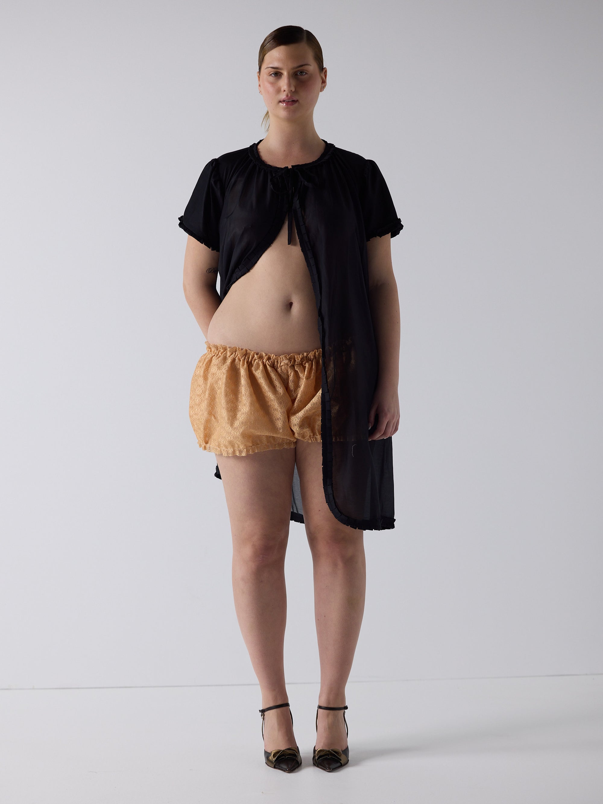 kim wears the frill peignoir cover up in black