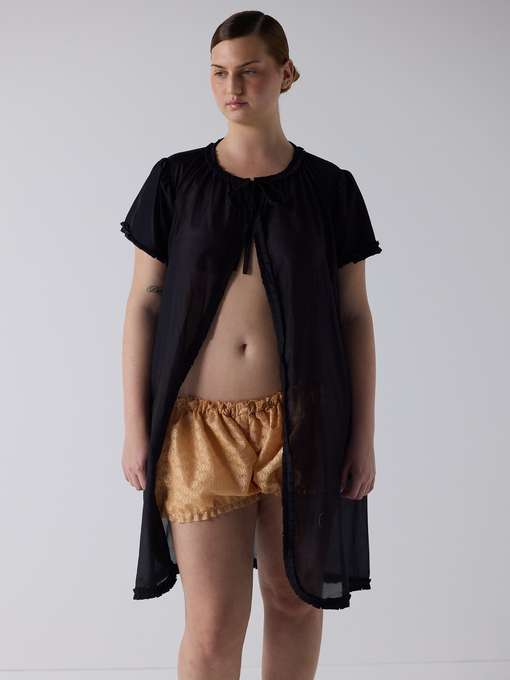 kim wears the frill peignoir cover up in black