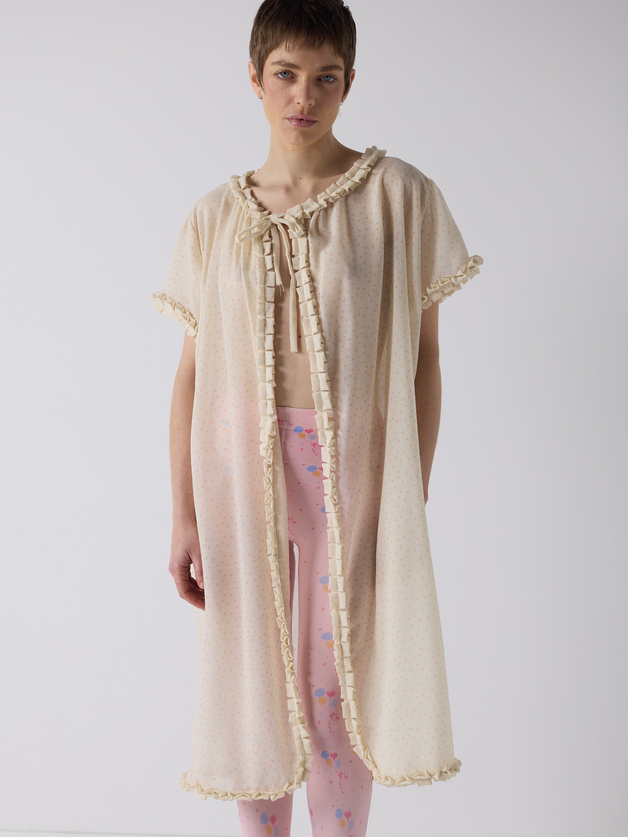 honor wears the frill peignoir cover up in micro dot wool