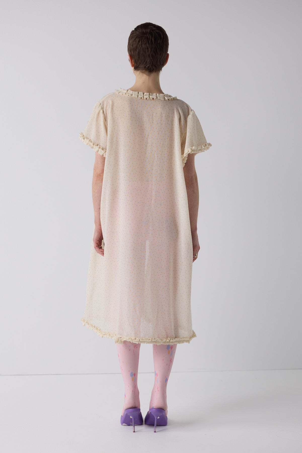 honor wears the frill peignoir cover up in micro dot wool