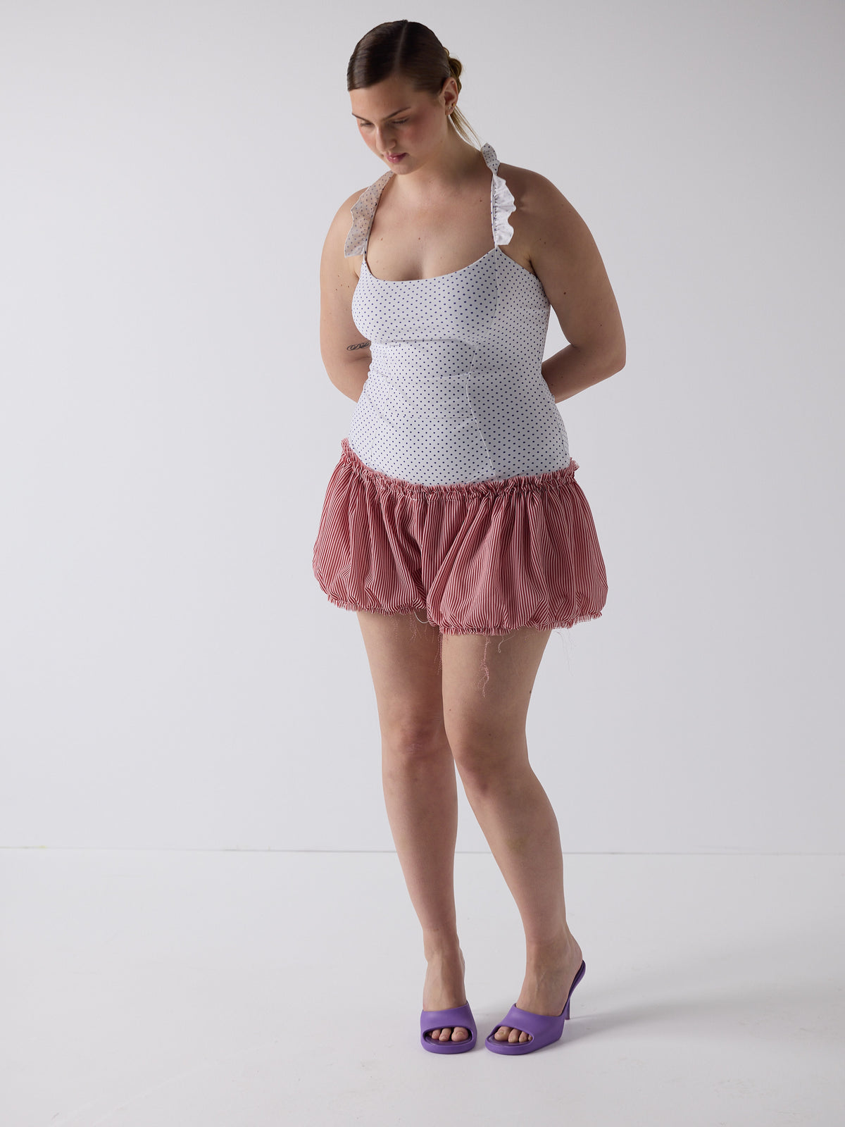 kim wears the puff shorts in lolly stripe, fit 2