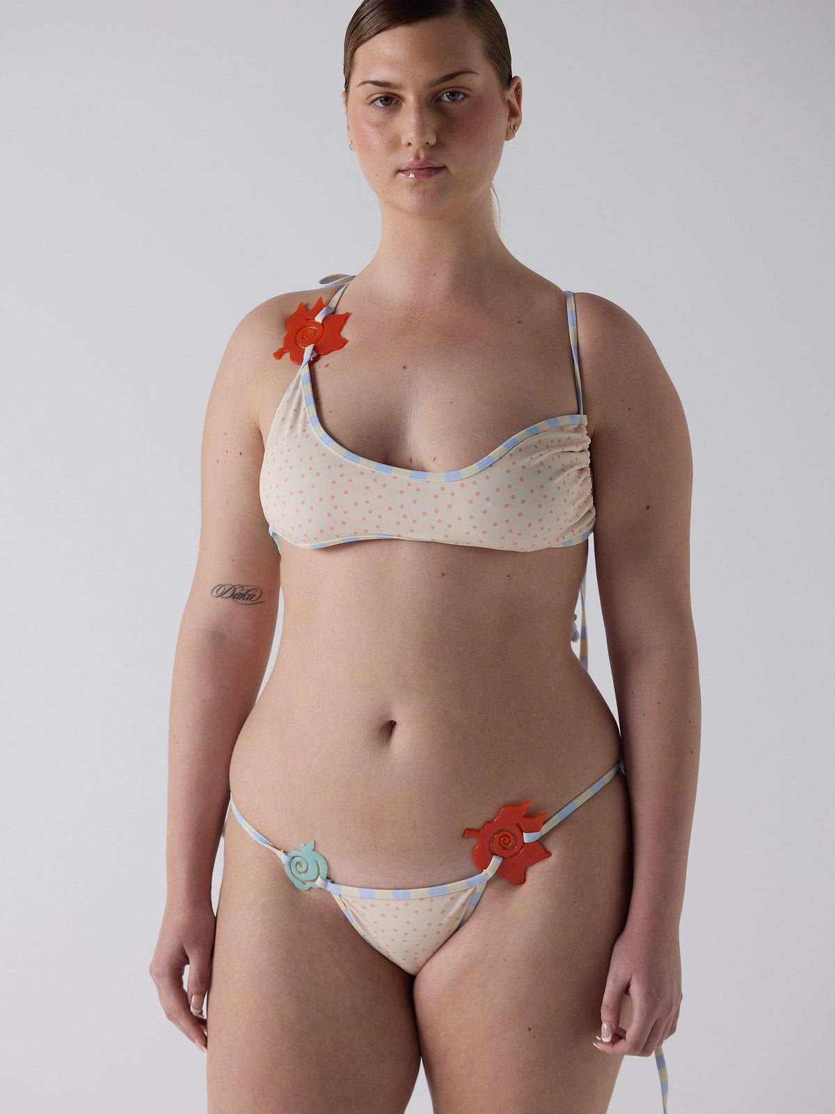 kim wears the multiway bikini in pink micro dot, fit 3