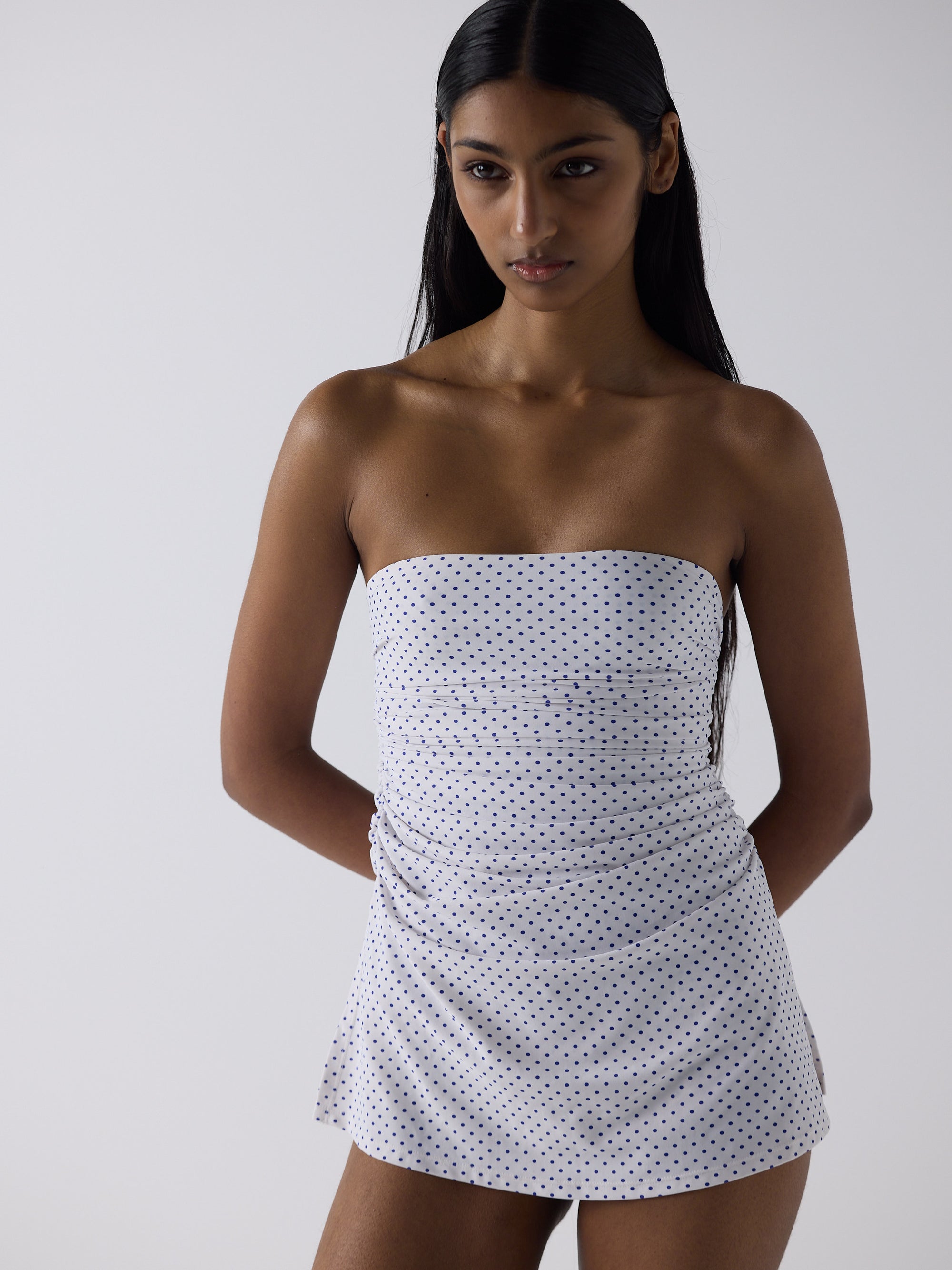 haasi wears the twist one piece in blue micro dot, size s