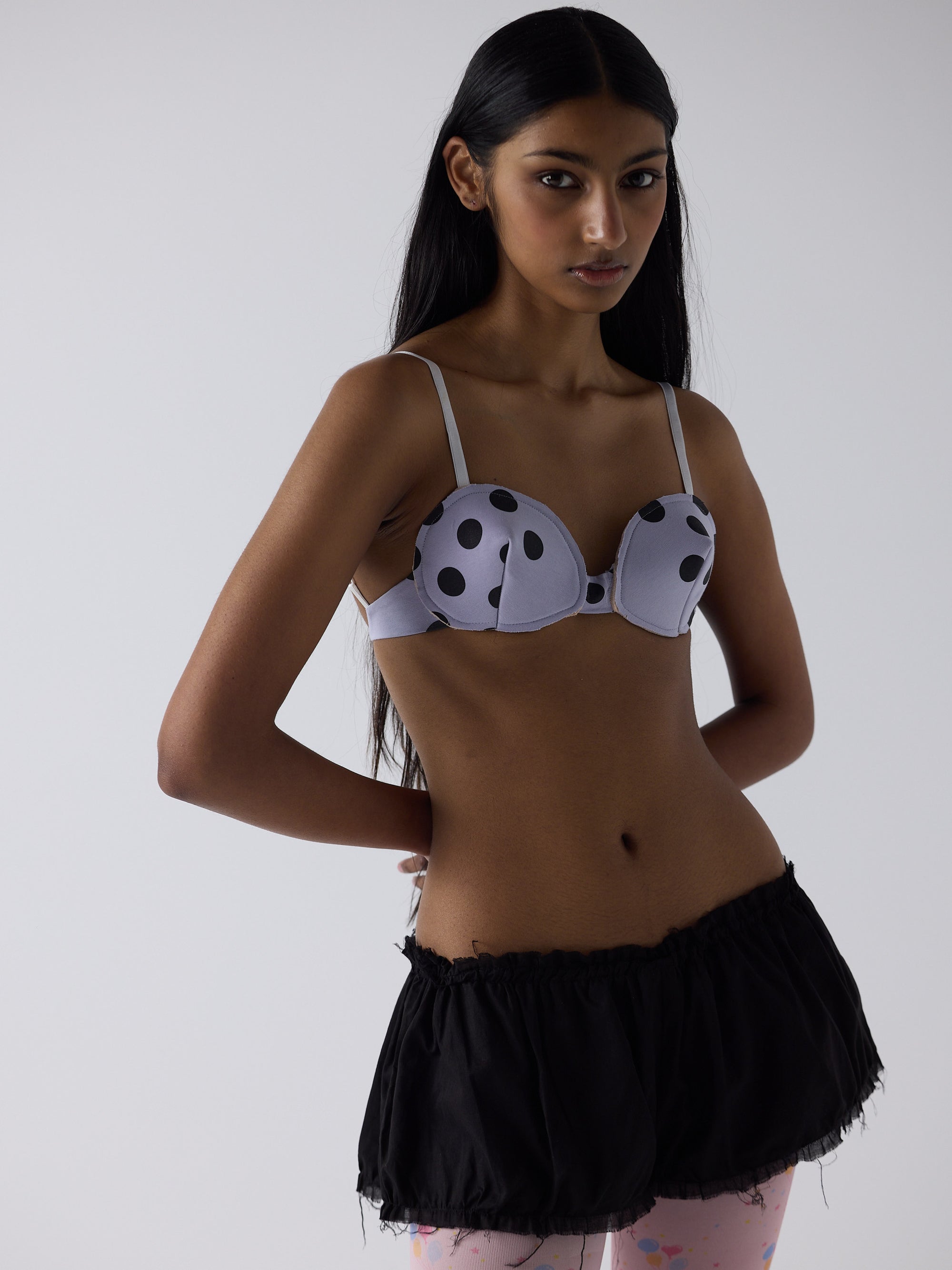 haasi wears the logo reusal bullet bra in lilac, fit 1