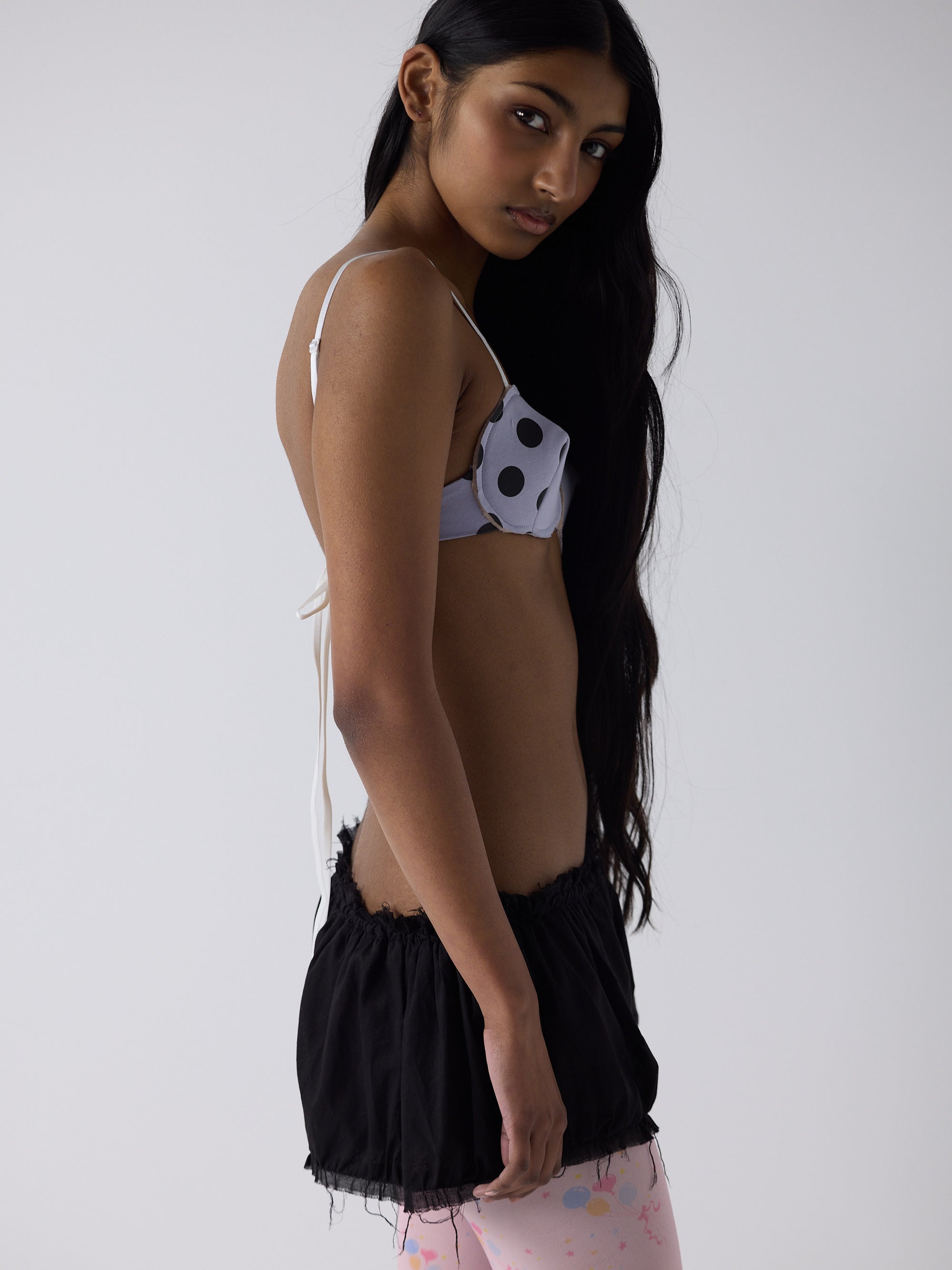 haasi wears the logo reusal bullet bra in lilac, fit 1