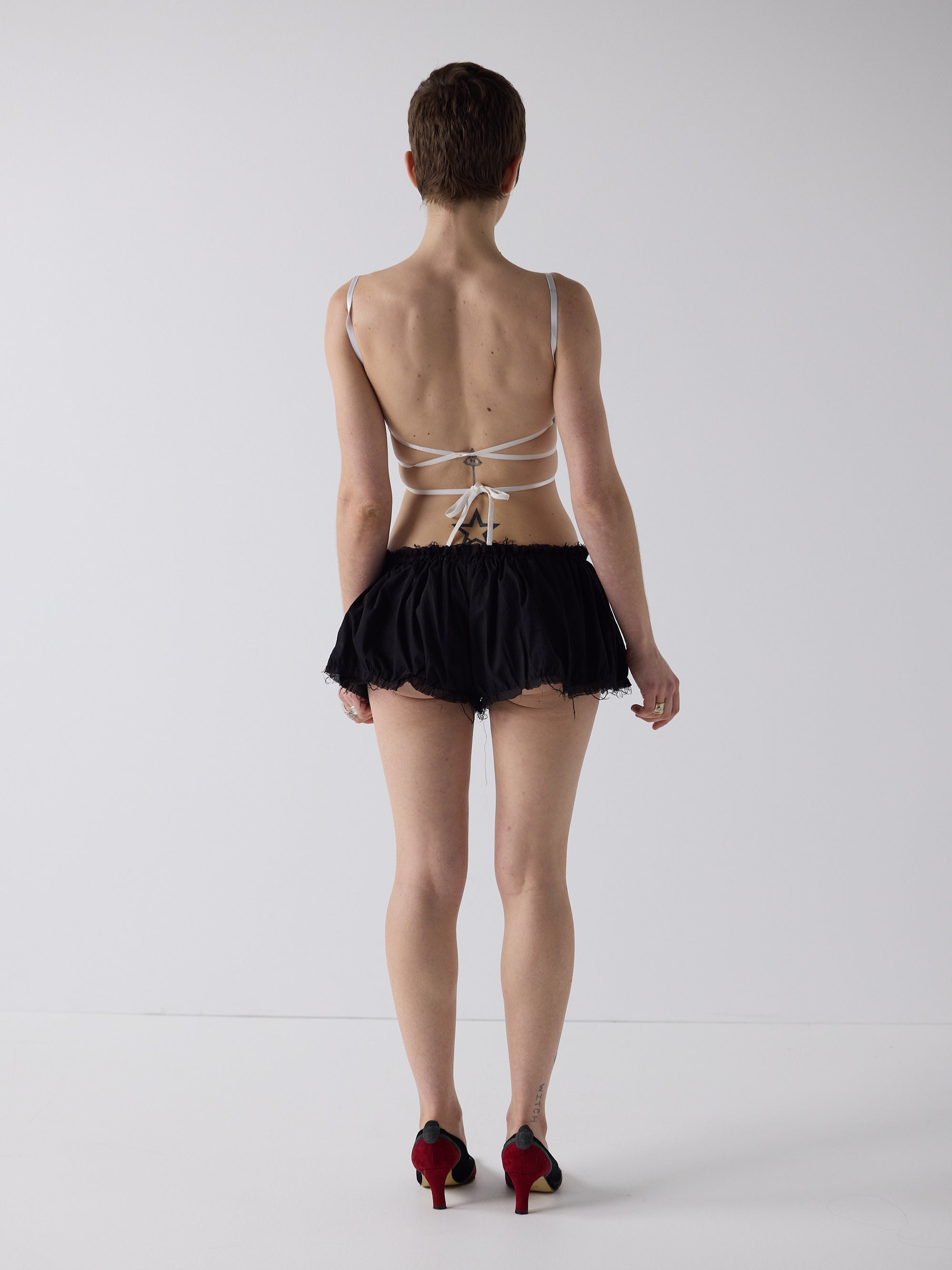 honor wears the niamh galea puff shorts in black cotton voile, hand made in the sydney studio