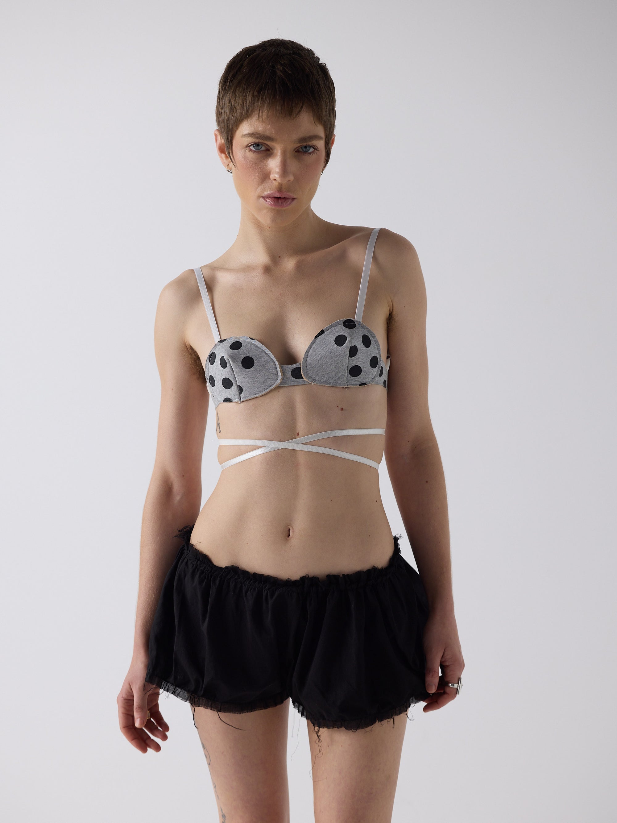 honor wears the logo reusal bullet bra in grey marle, fit 1