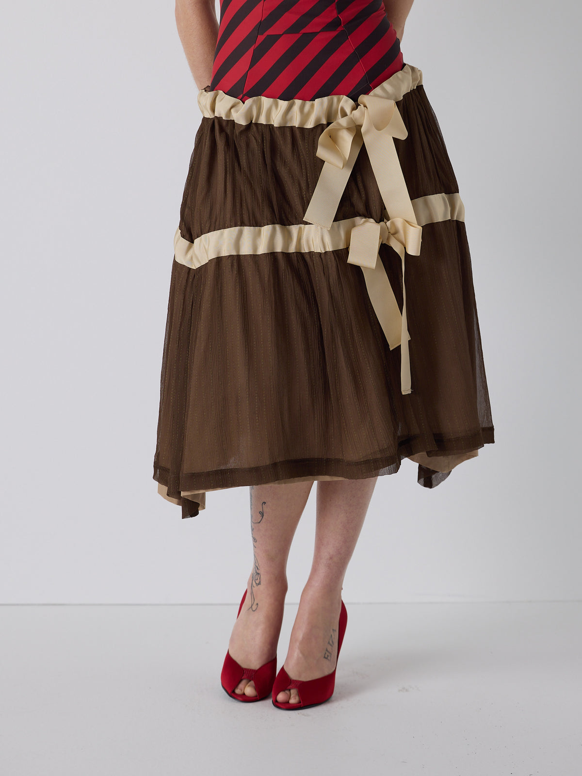 honor wears the drop waist tiered skirt in brown, fit 1
