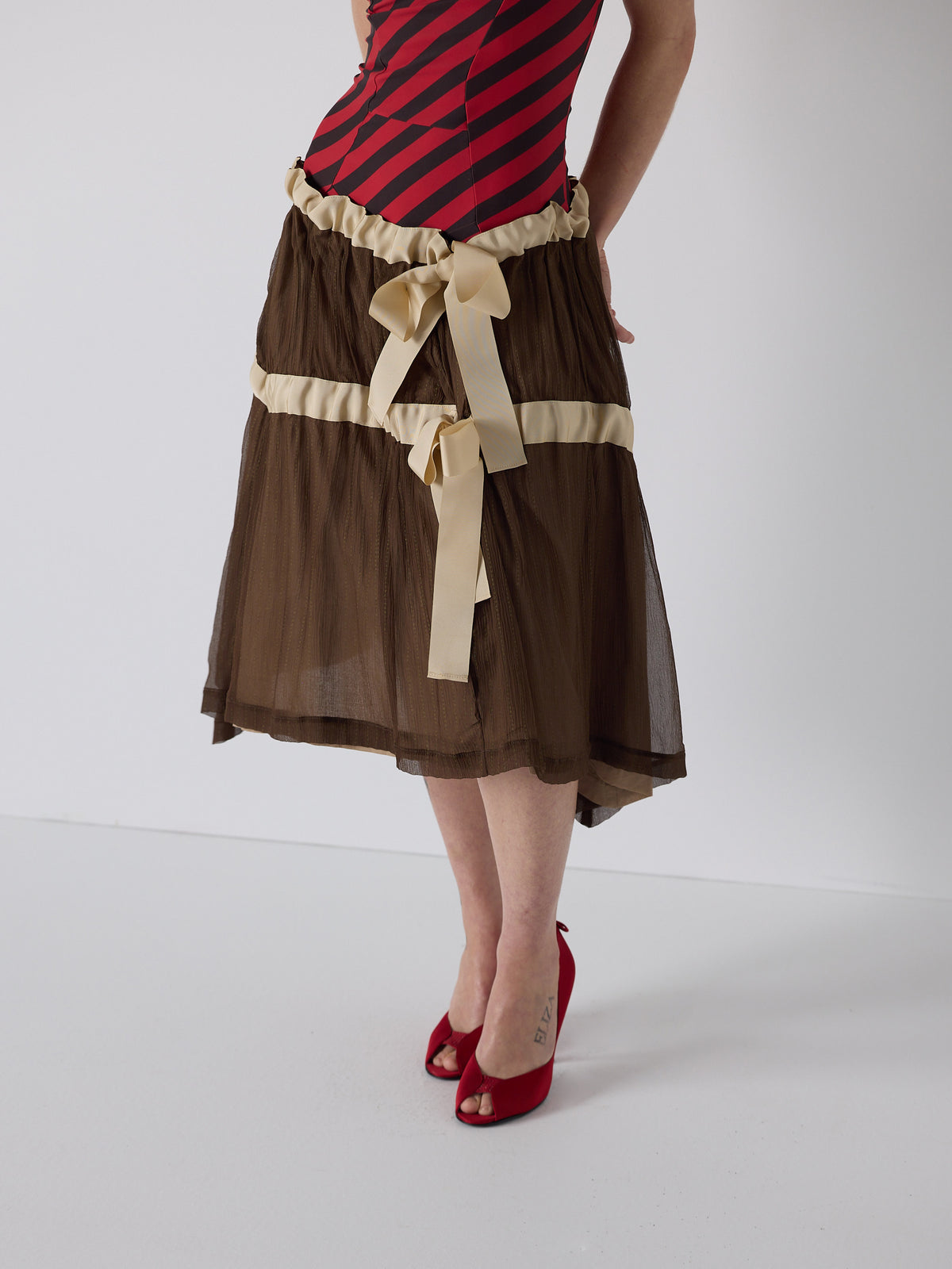 honor wears the drop waist tiered skirt in brown, fit 1