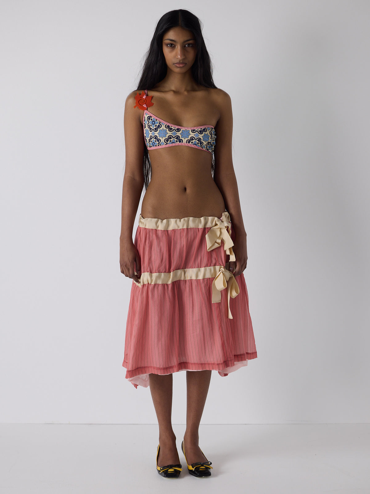 haasi wears the drop waist tiered skirt in flesh, fit 1