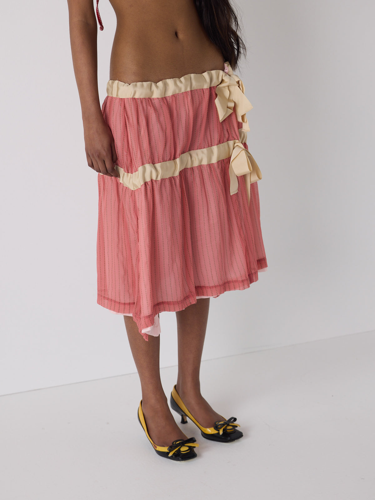 haasi wears the drop waist tiered skirt in flesh, fit 1