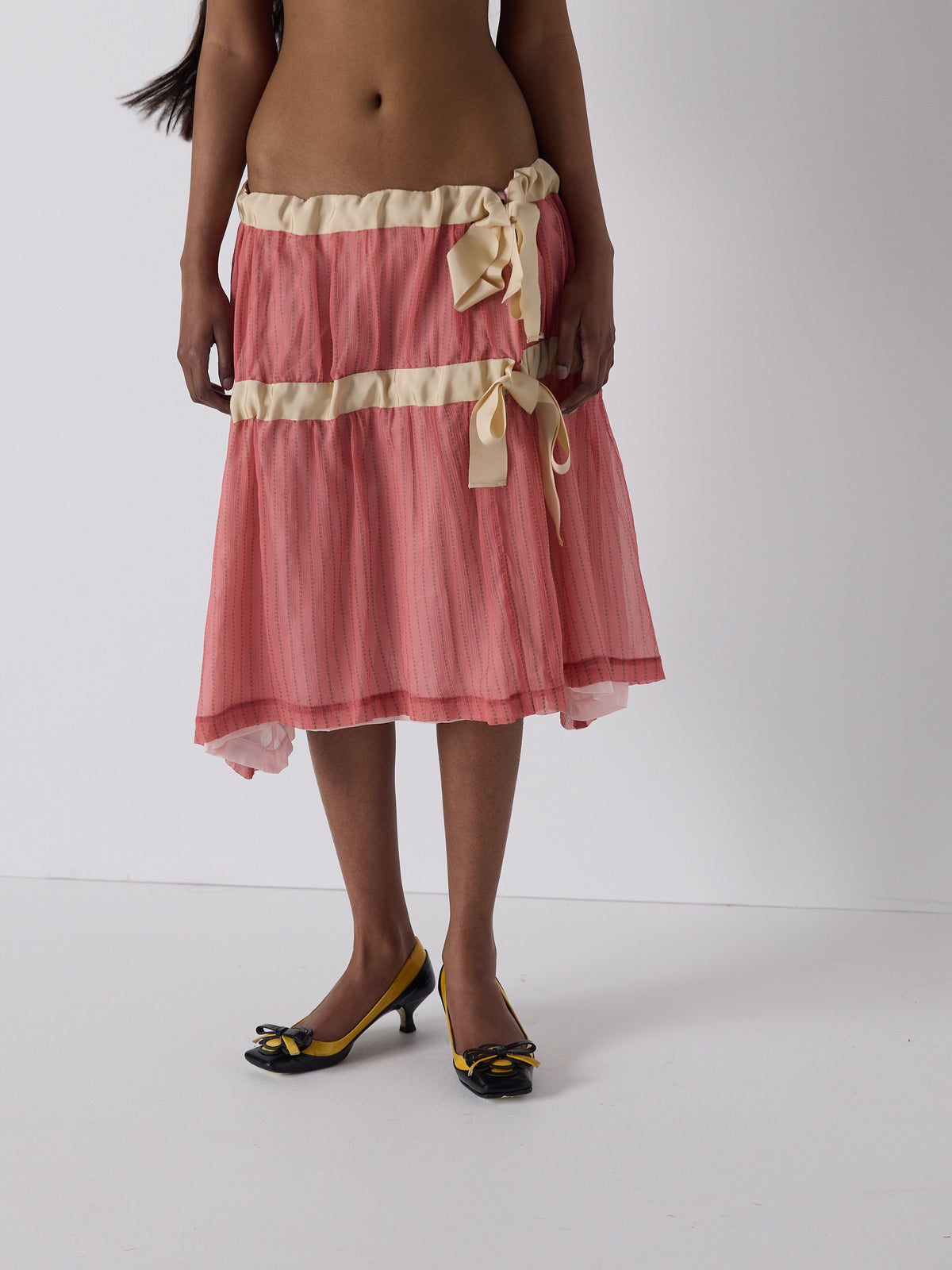 haasi wears the drop waist tiered skirt in flesh, fit 1