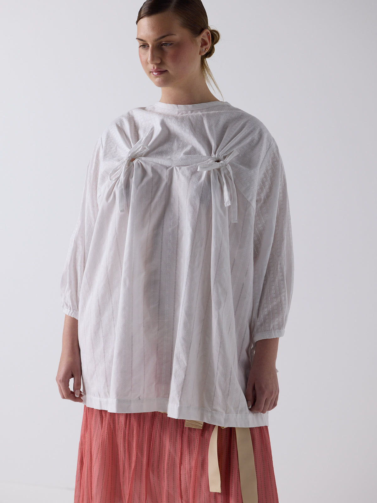 kim wears the drop waist tiered skirt in flesh, fit 2