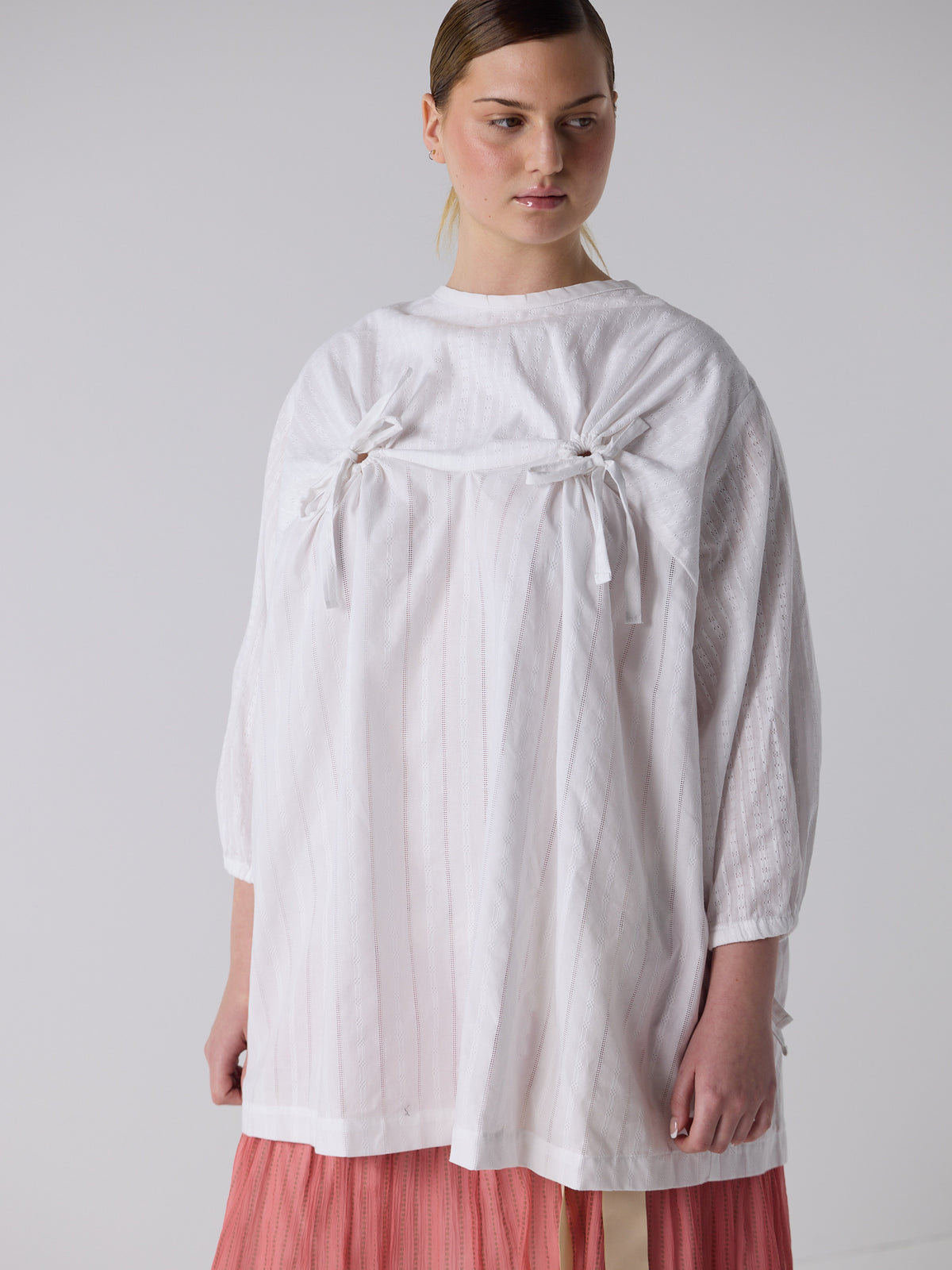 kim wears the drop waist tiered skirt in flesh, fit 2