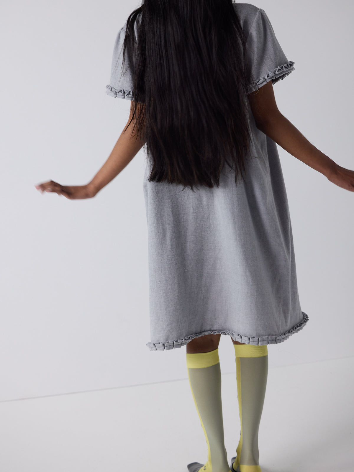 haasi wears the frill peignoir in grey